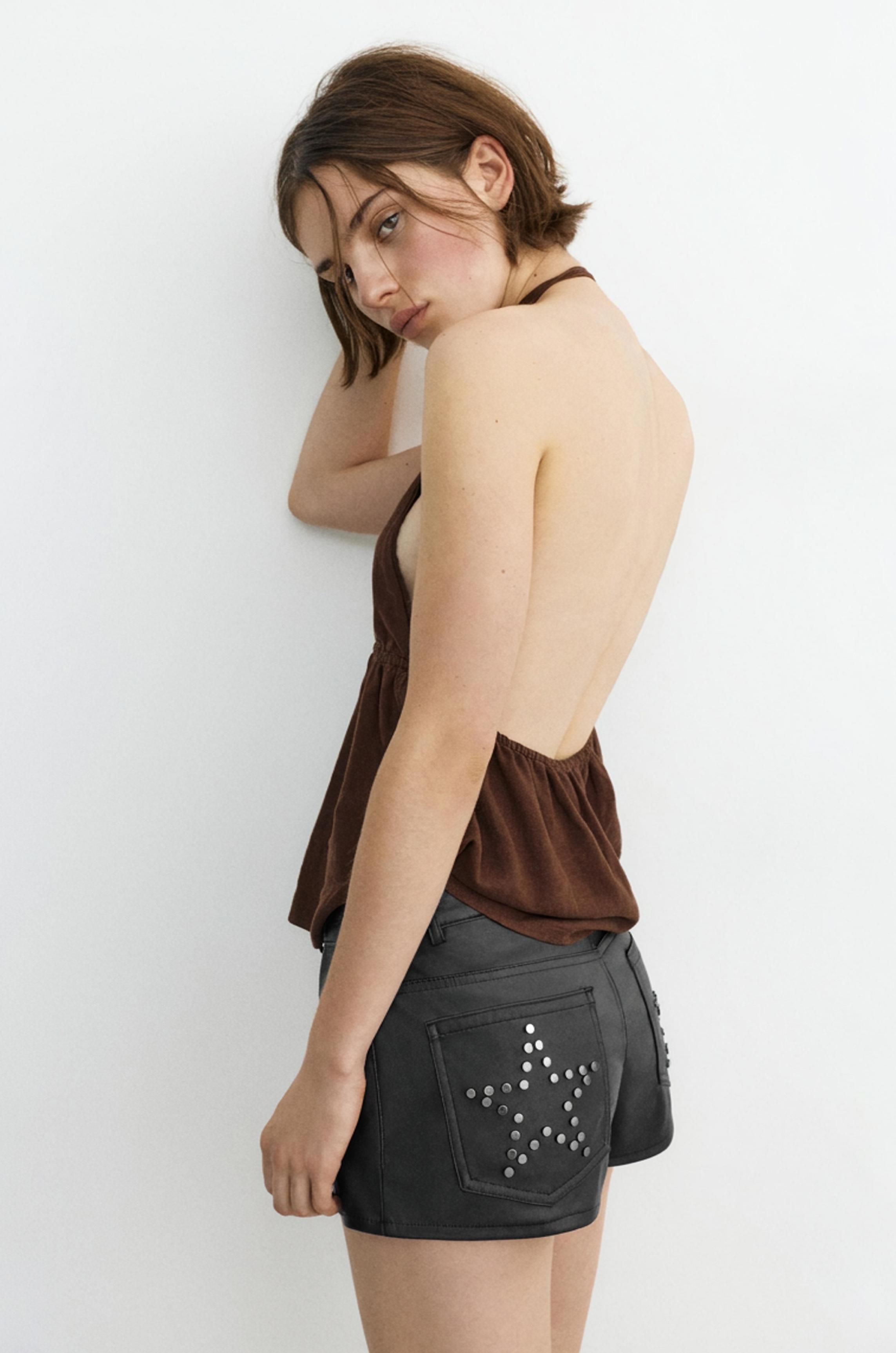 Studded faux leather mini shorts — Black