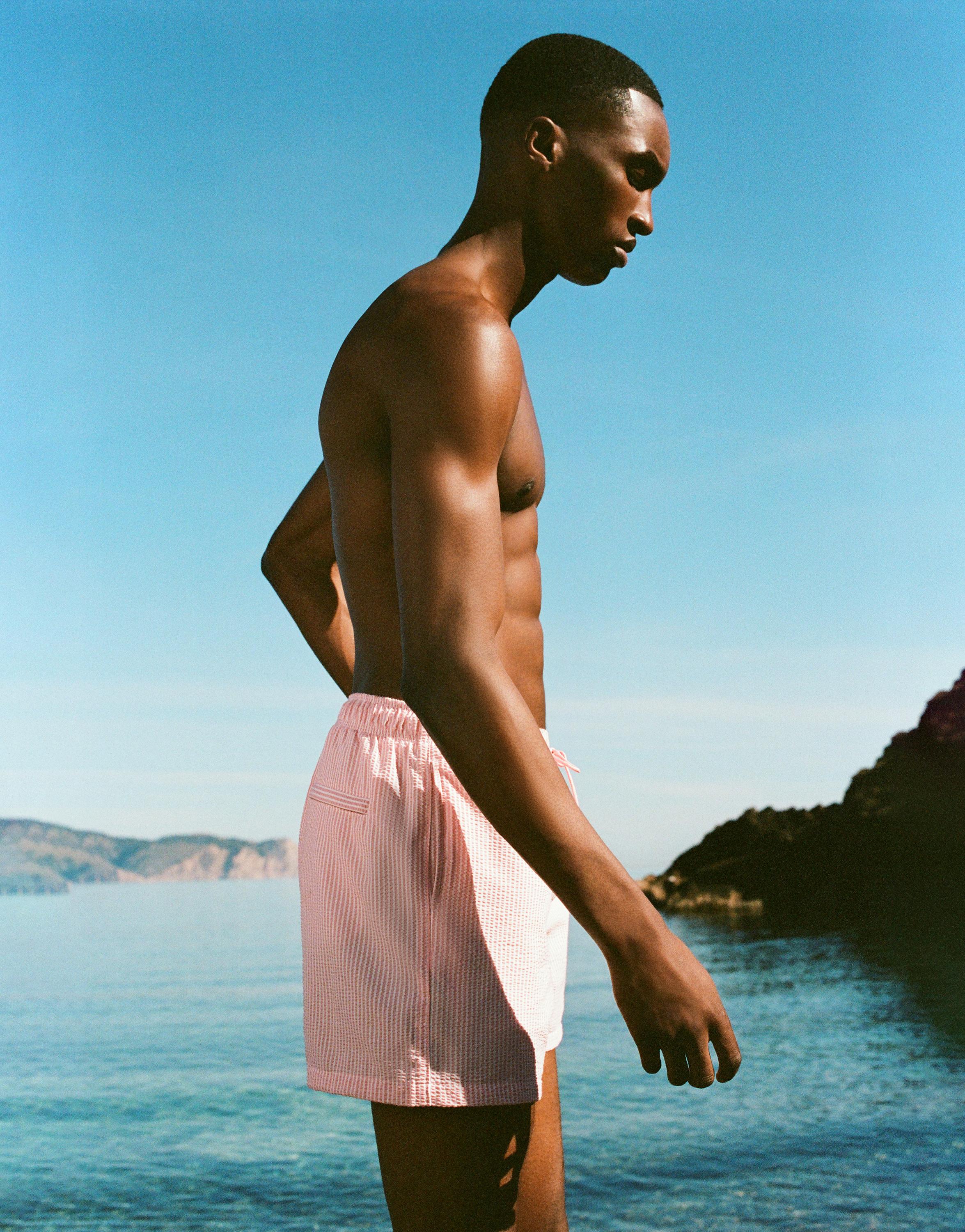 Striped seersucker swimming trunks — Pink