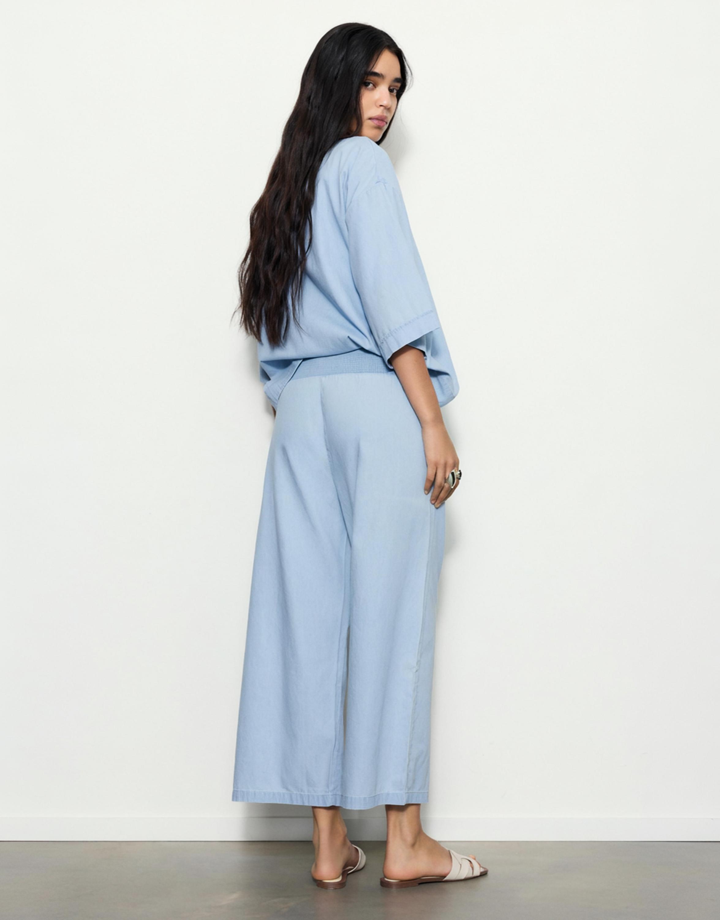 Flowing denim trousers with elasticated waist — Pale blue