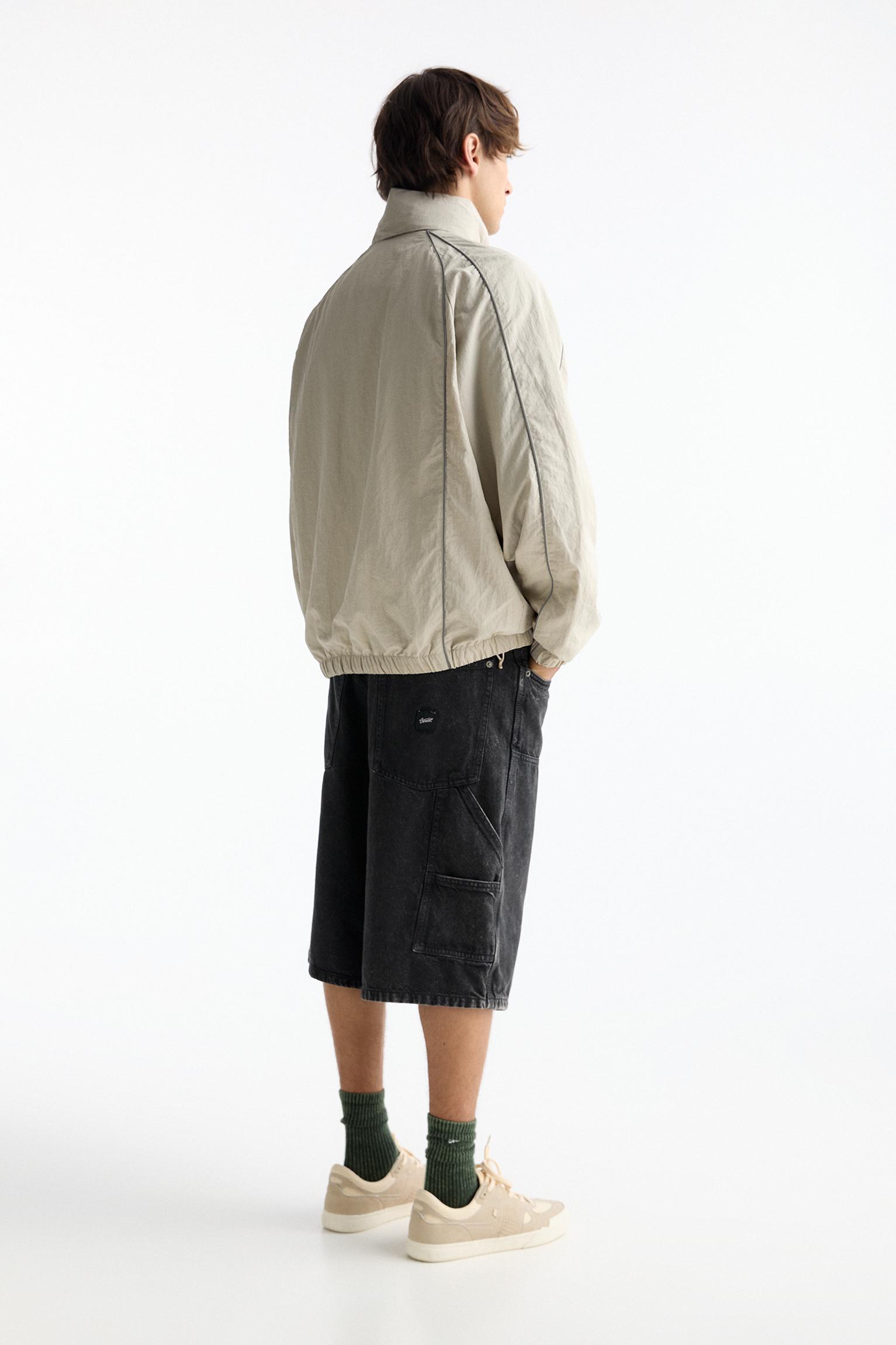 STWD raincoat with contrast seams PULL BEAR