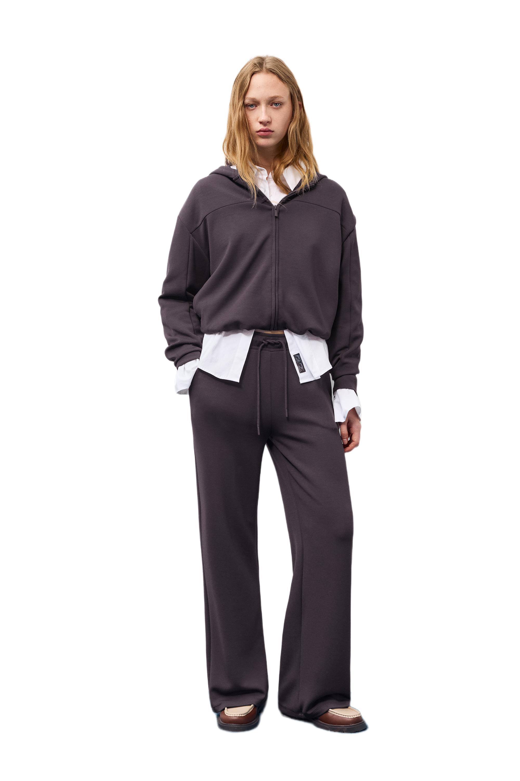 Soft-touch wide-leg trousers — Black