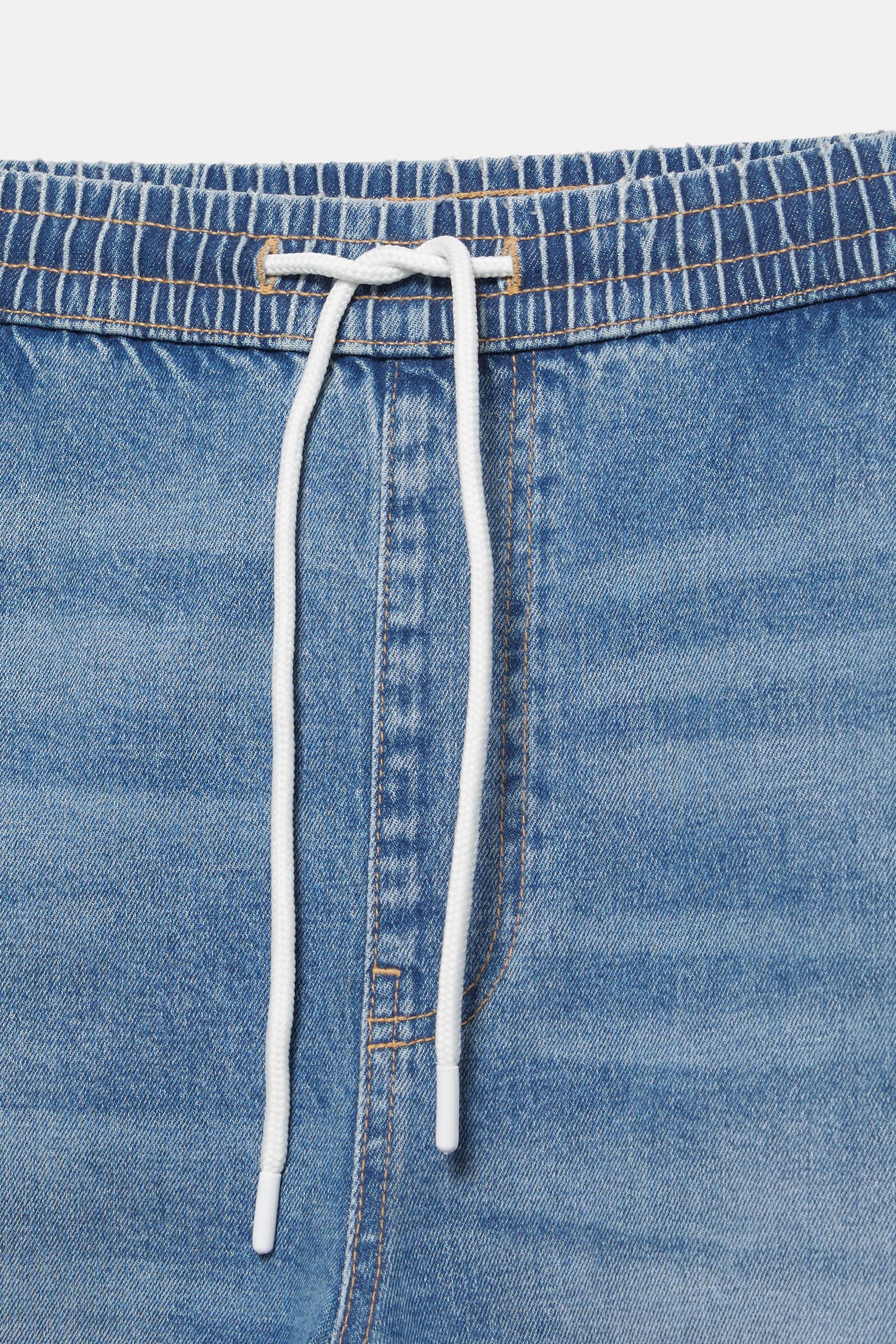 Ripped denim jogger trousers — Pale indigo