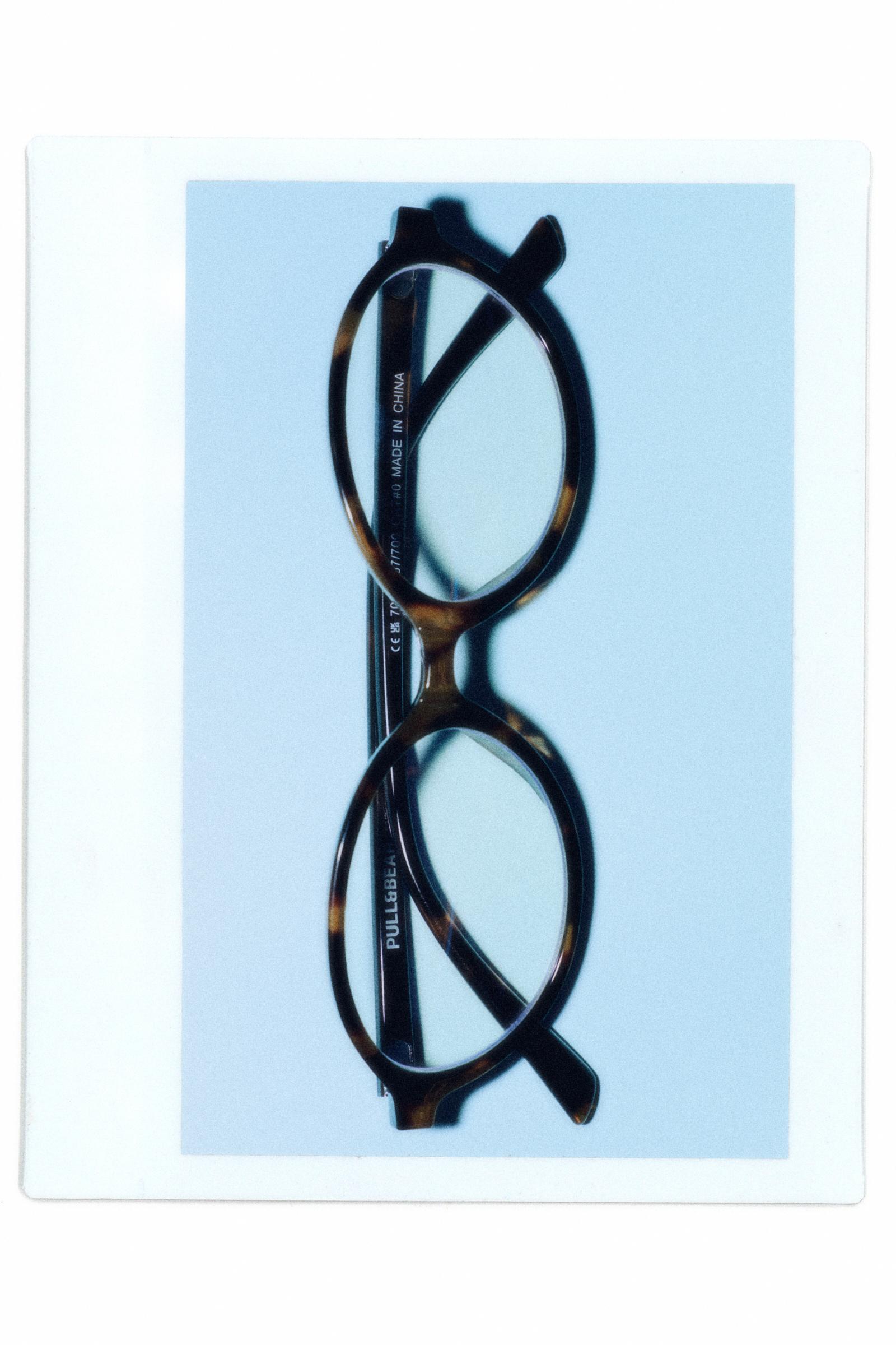 Oval tortoiseshell-effect sunglasses — Brown