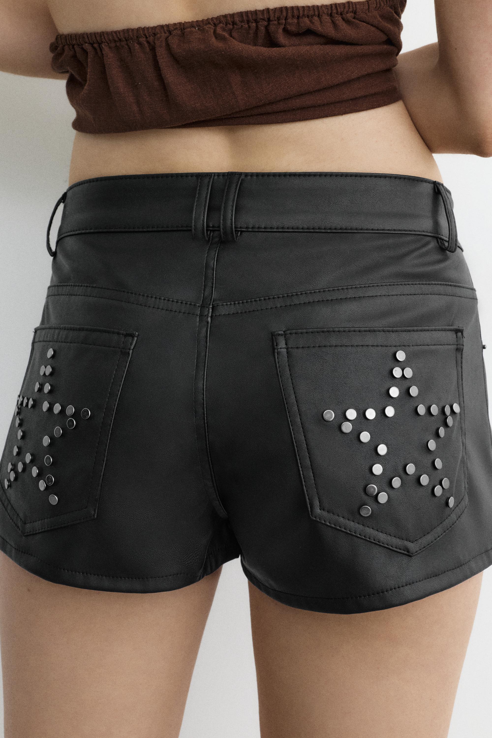 Studded faux leather mini shorts — Black