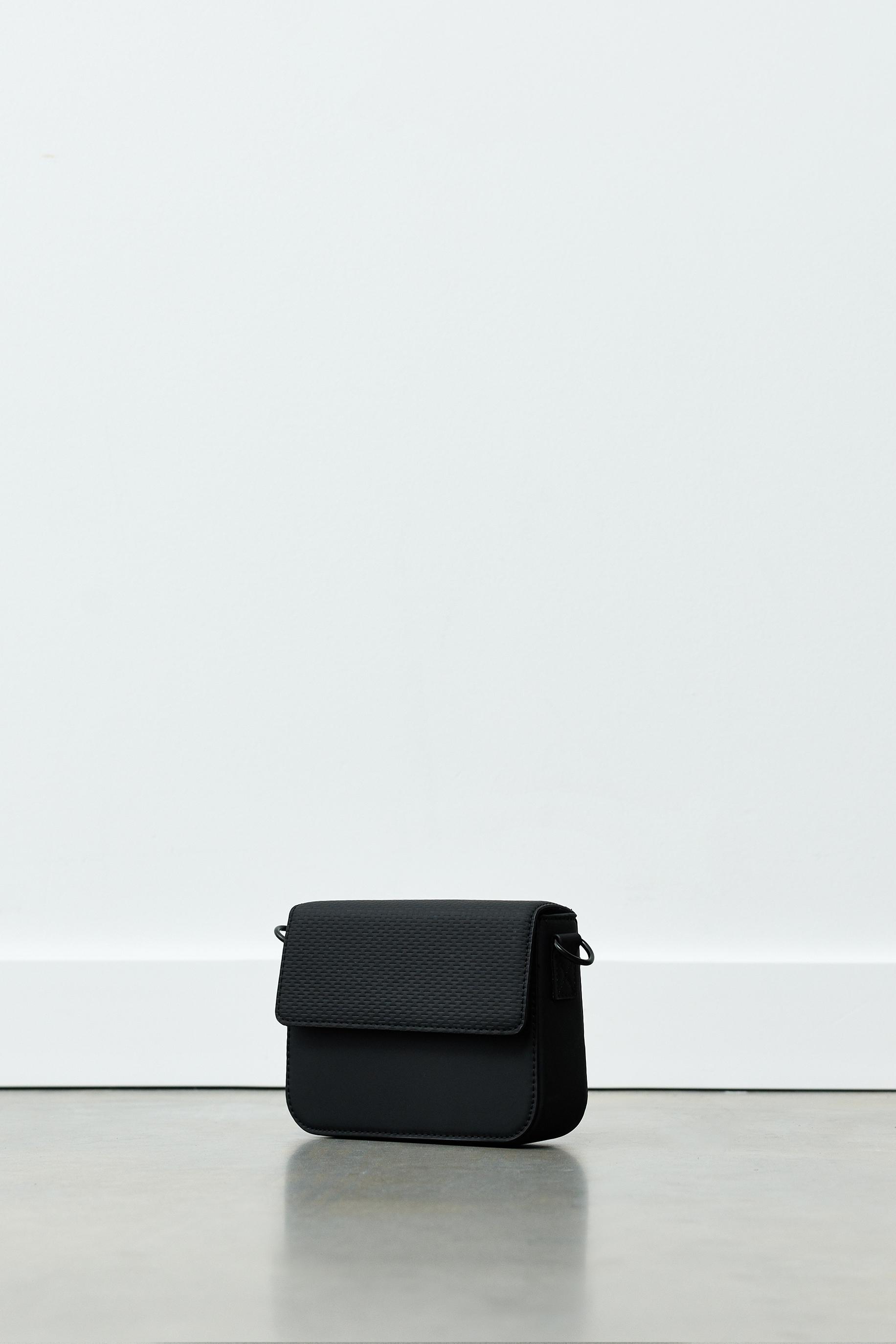 Rubberised textured crossbody bag — Black