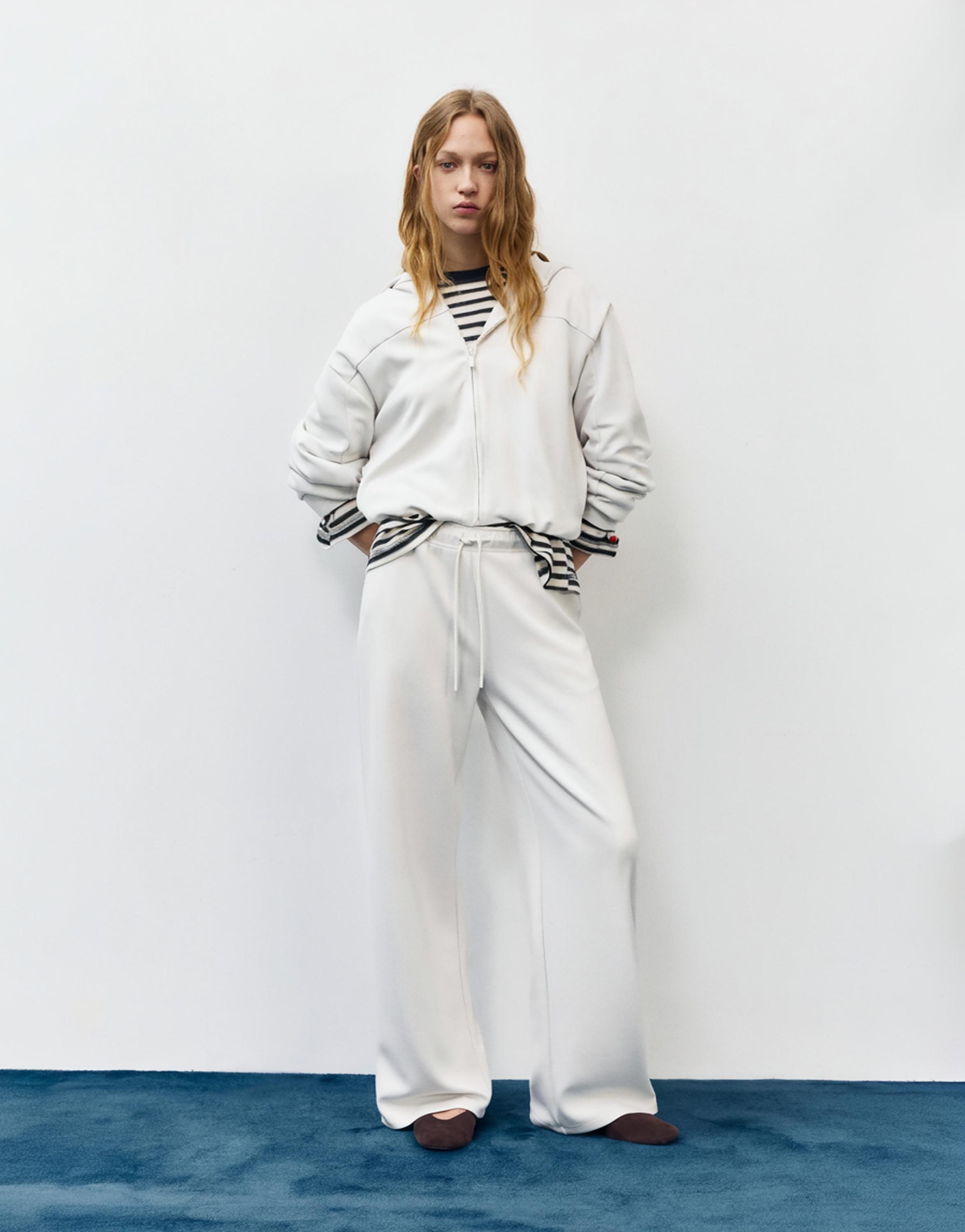 Soft-touch wide-leg trousers — Ecru