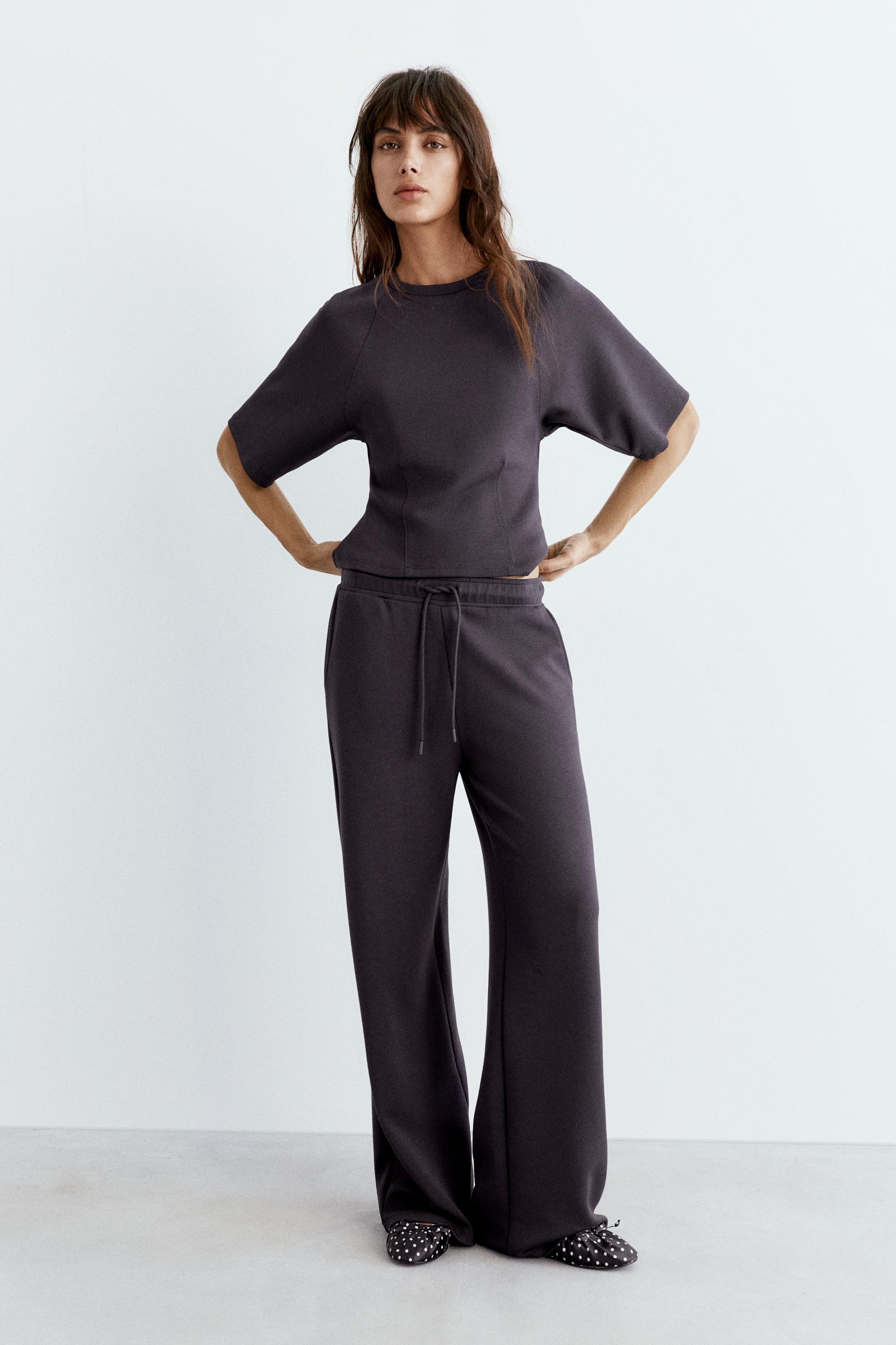 Soft-touch wide-leg trousers — Black