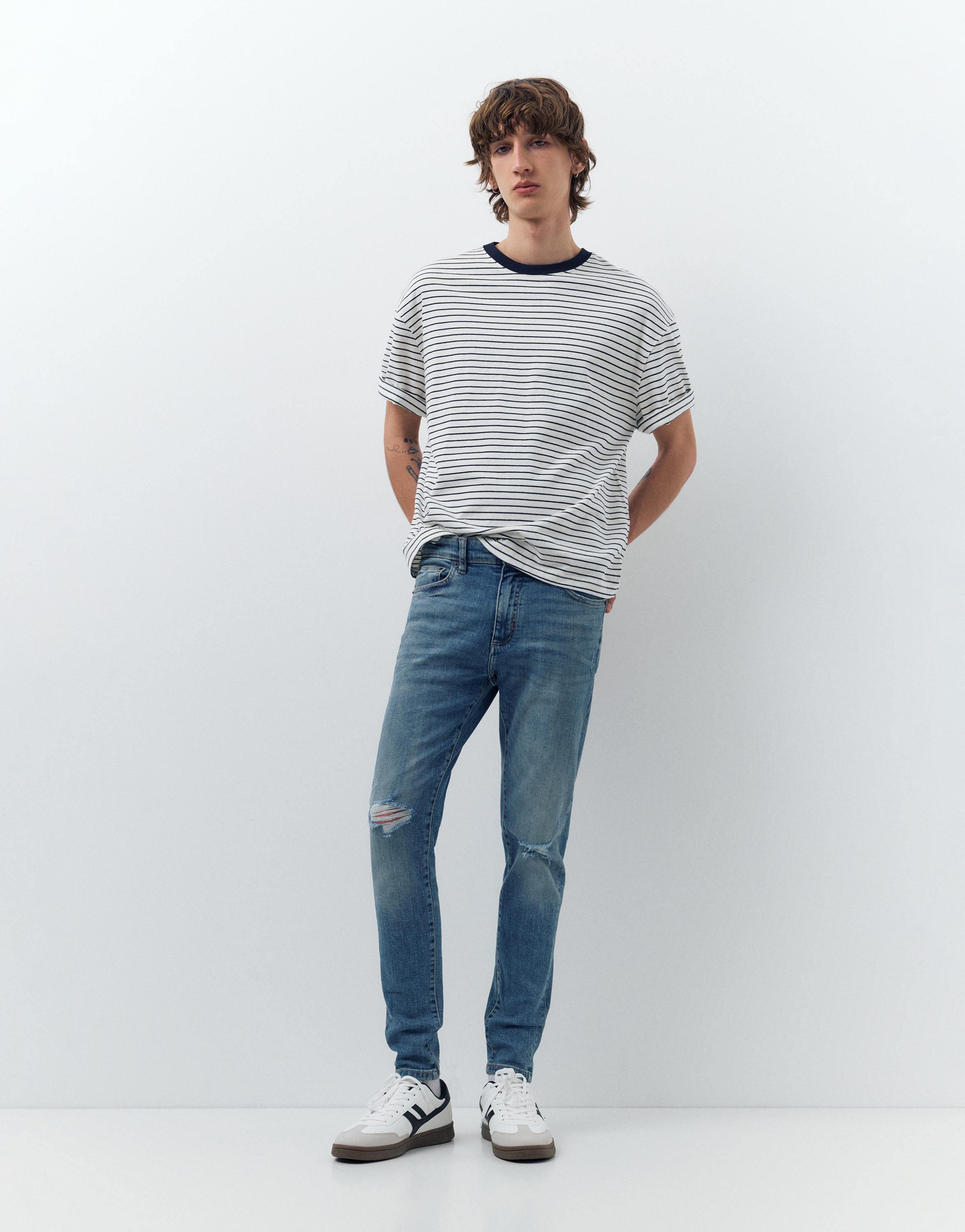 Ripped skinny jeans — Medium blue
