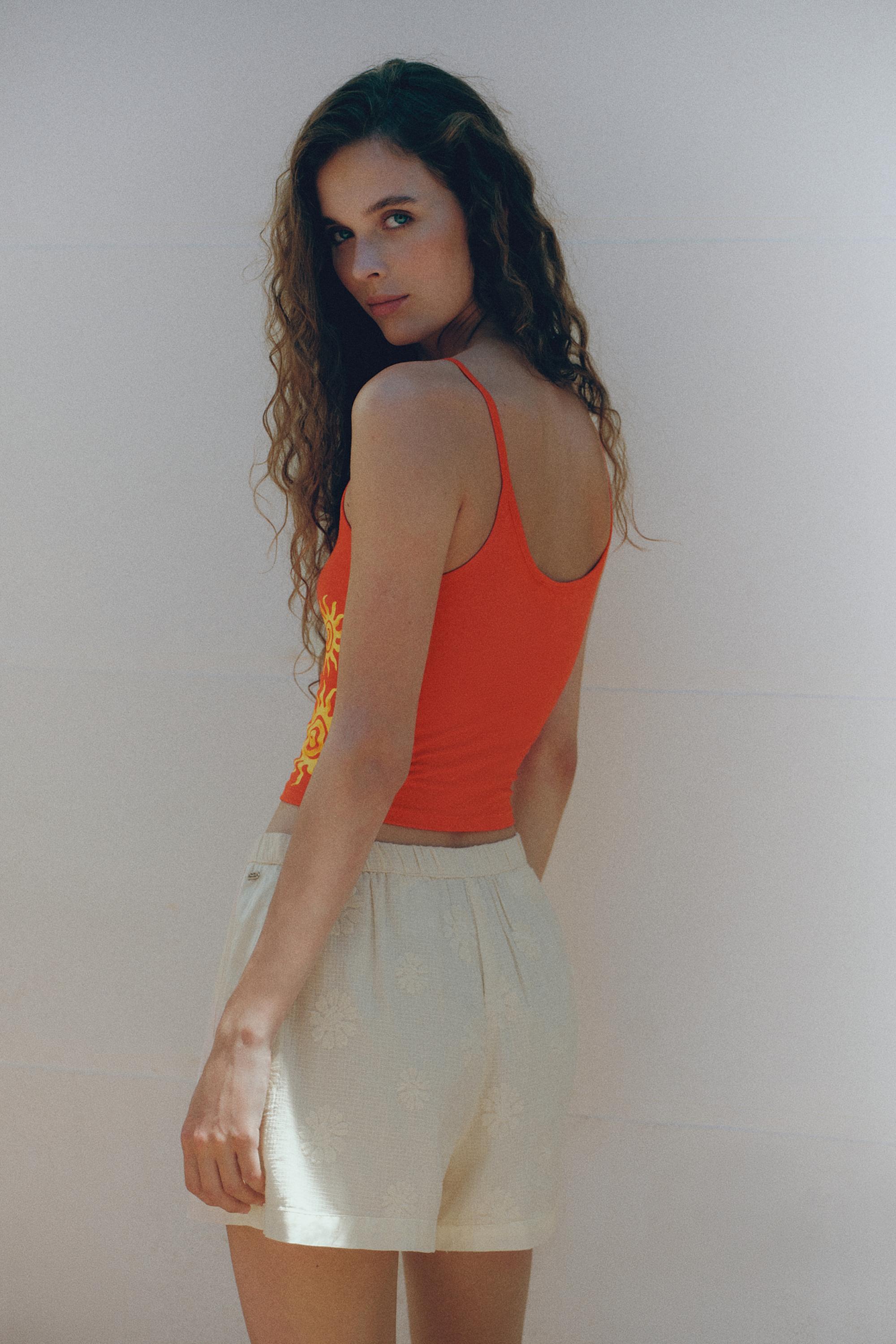 Orange sun graphic top — Red