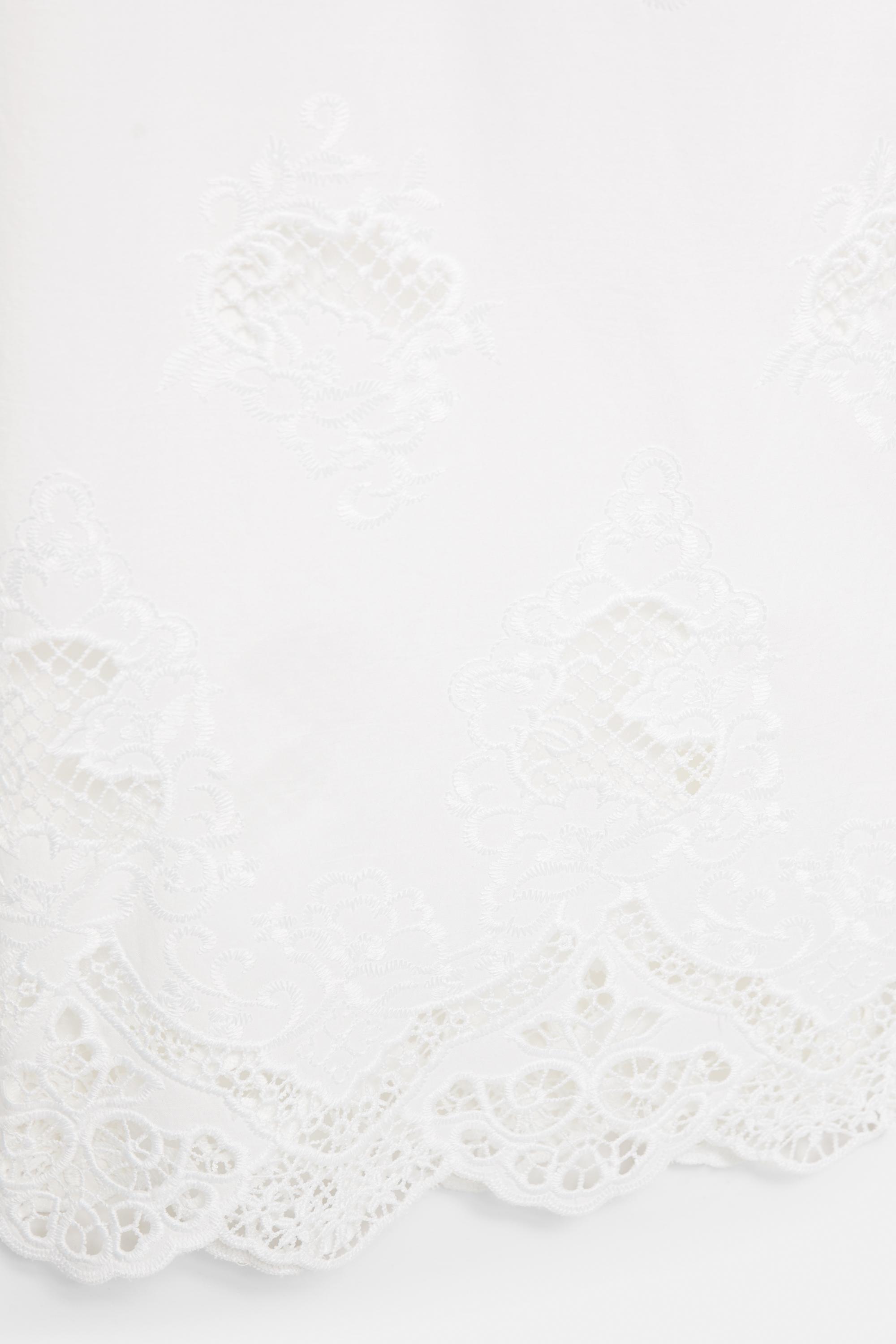 White trousers with Swiss embroidery — White