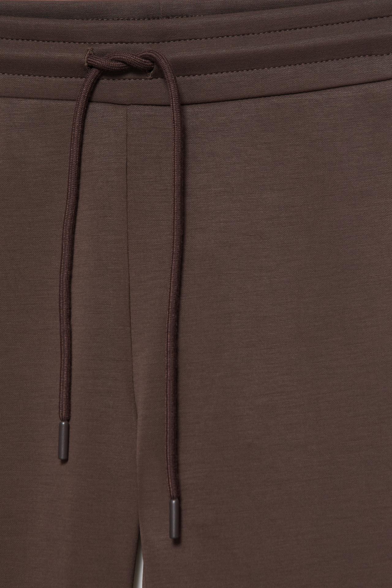 Soft-touch flared trousers — Brown