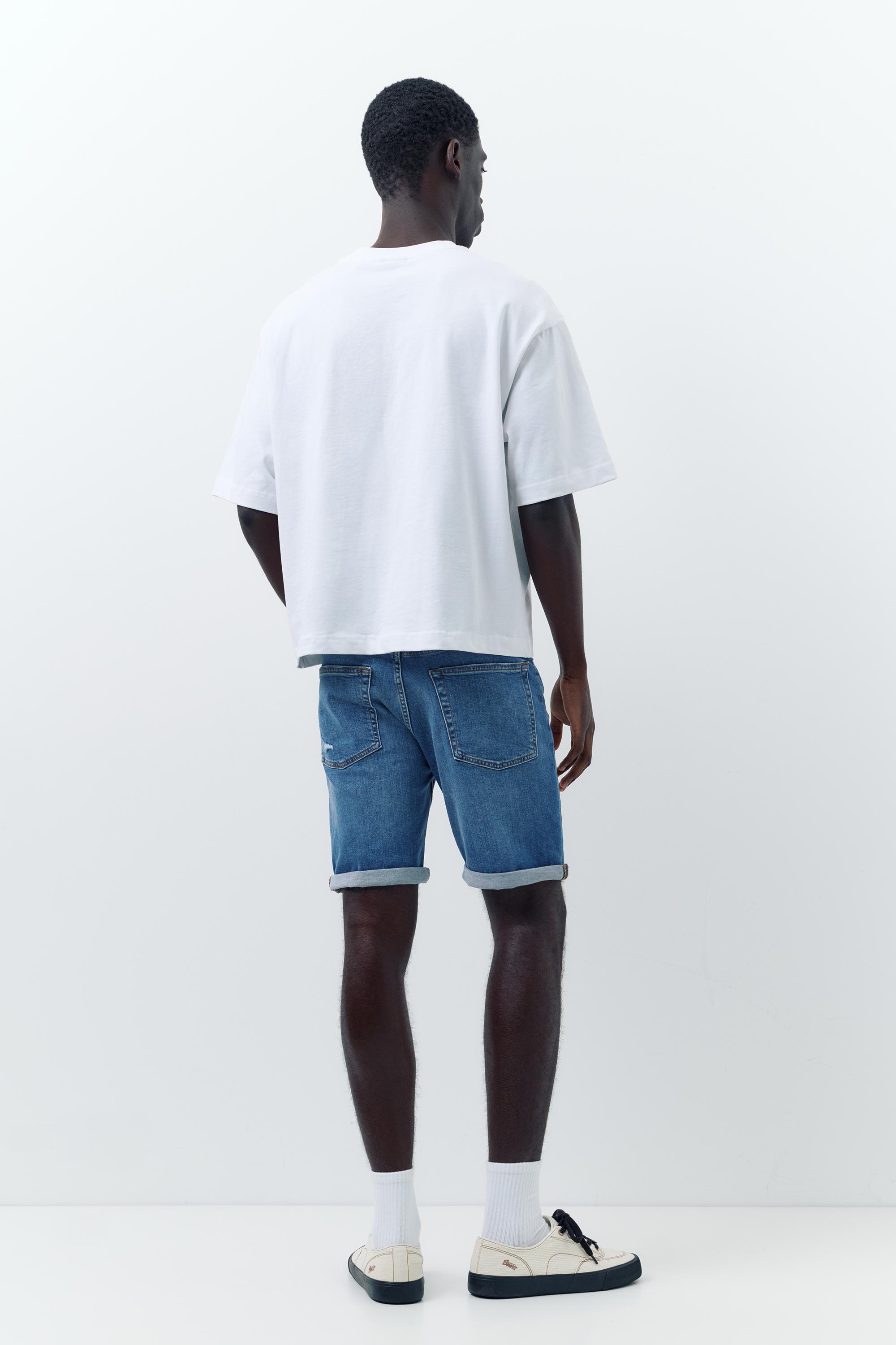 Ripped denim Bermuda shorts — Medium blue