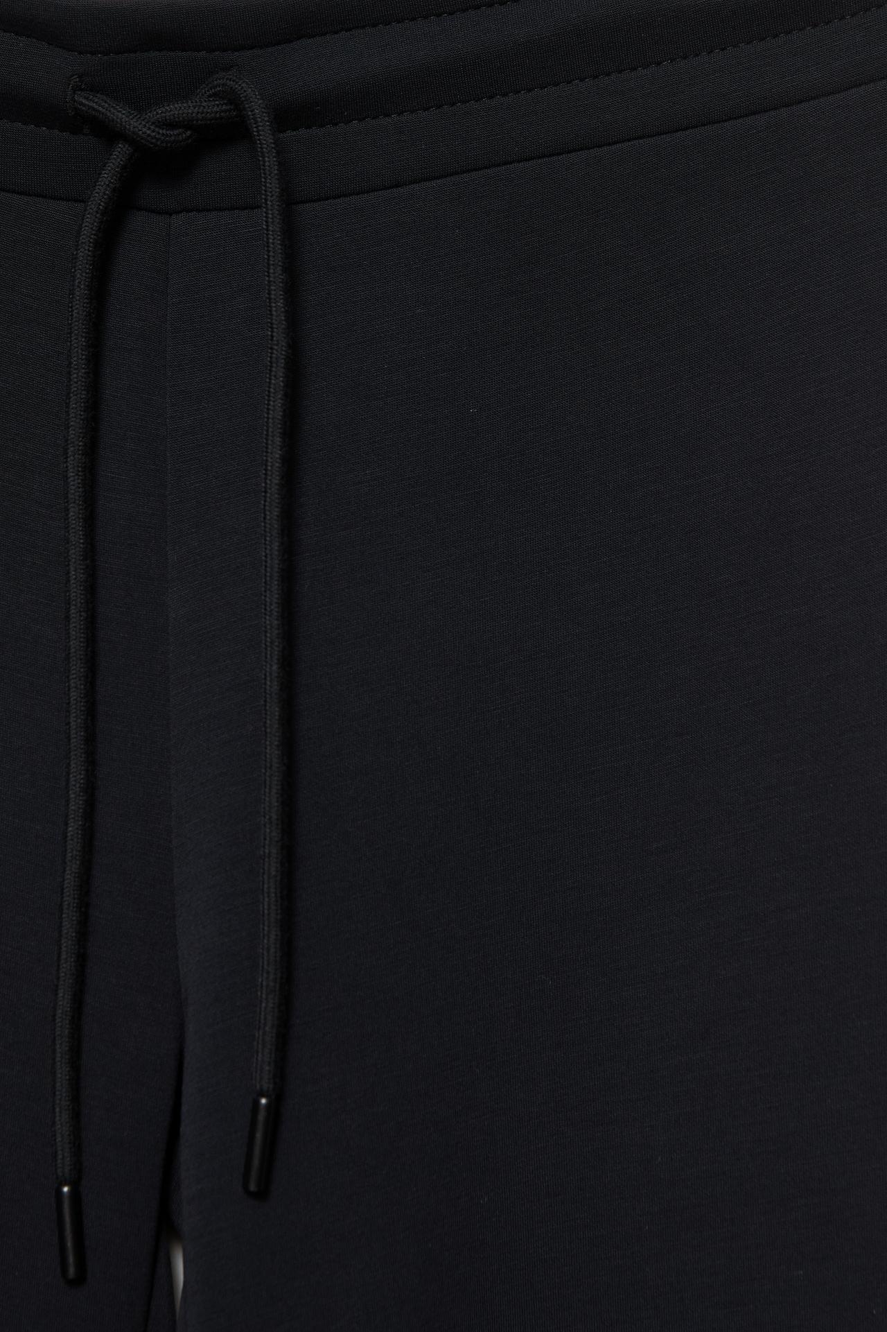 Soft-touch flared trousers — Black