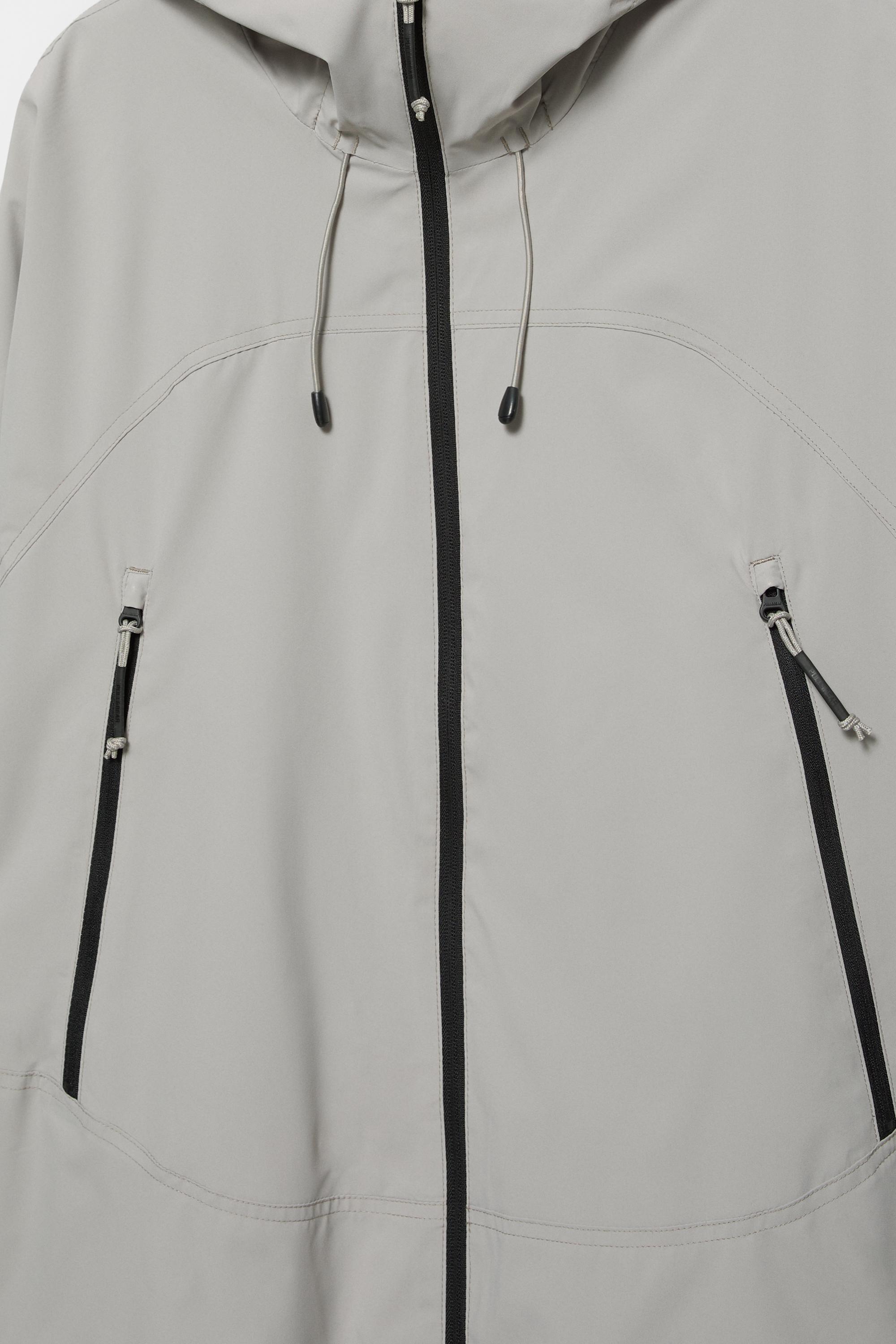 Lightweight hooded raincoat — Pale marl