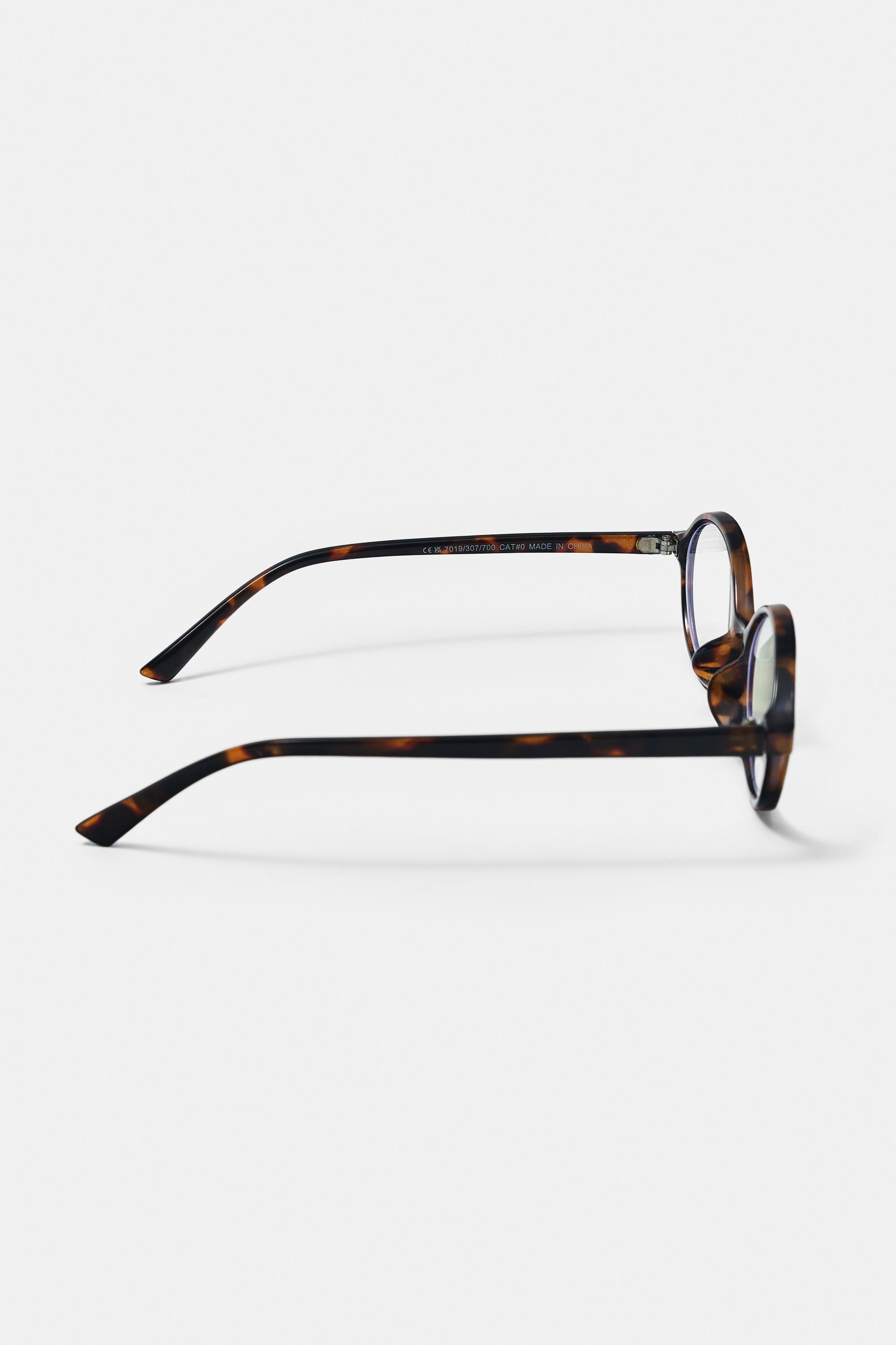 Oval tortoiseshell-effect sunglasses — Brown