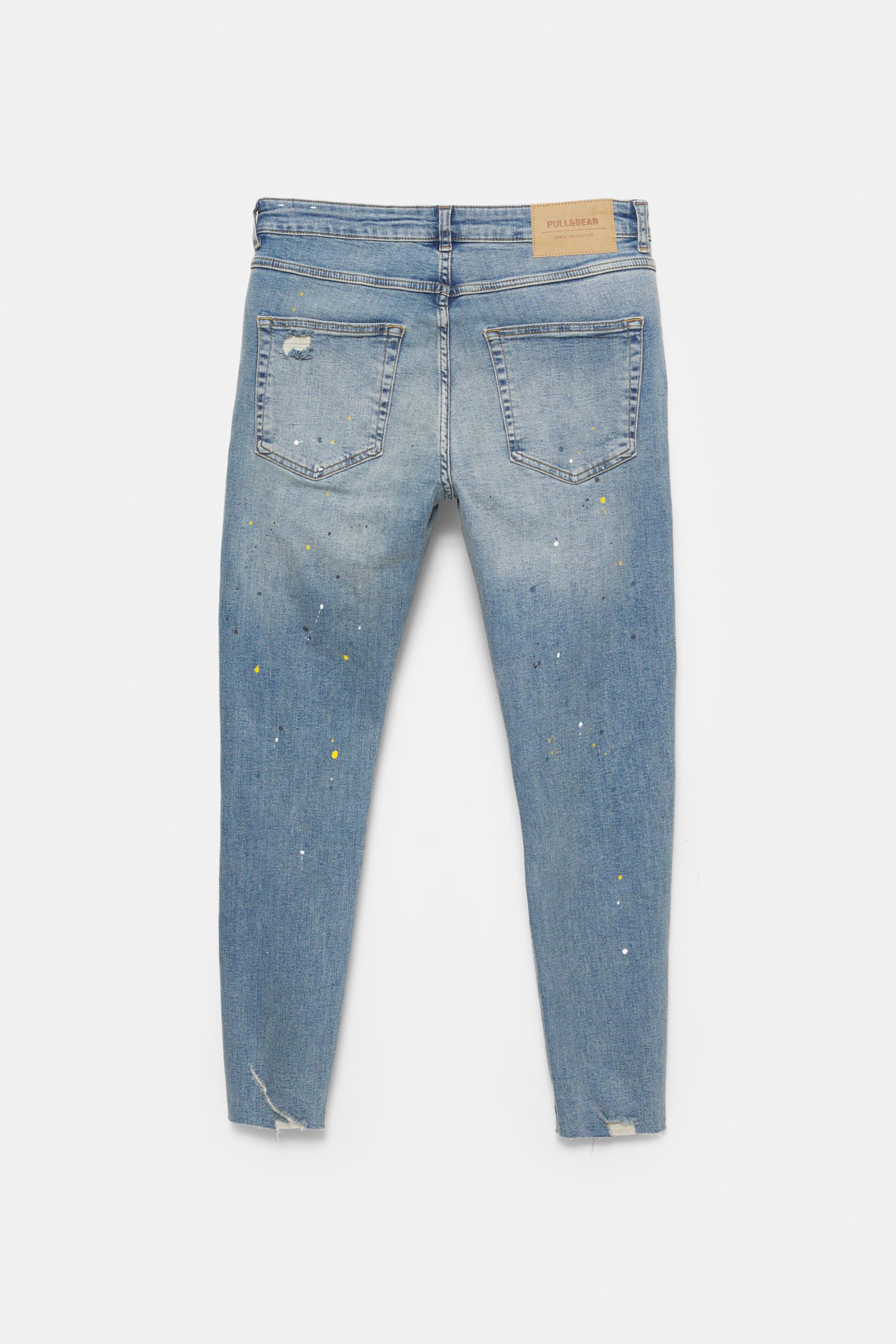 Paint splatter carrot-fit jeans — Medium blue