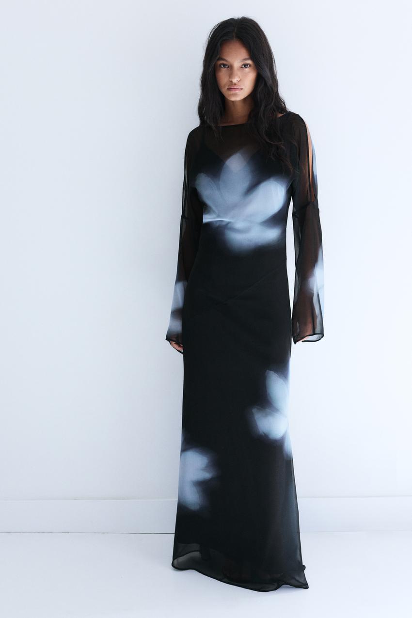 Black maxi dress set with blurred floral print, semi-sheer long sleeves.
