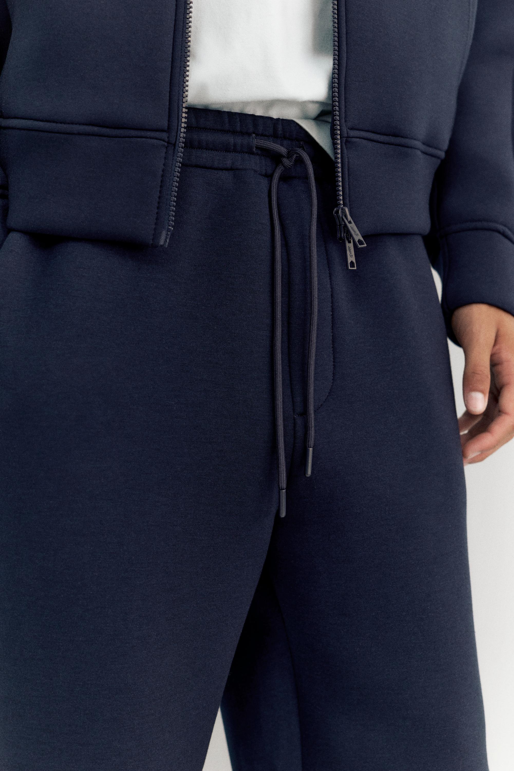 Neoprene-effect baggy trousers — Navy