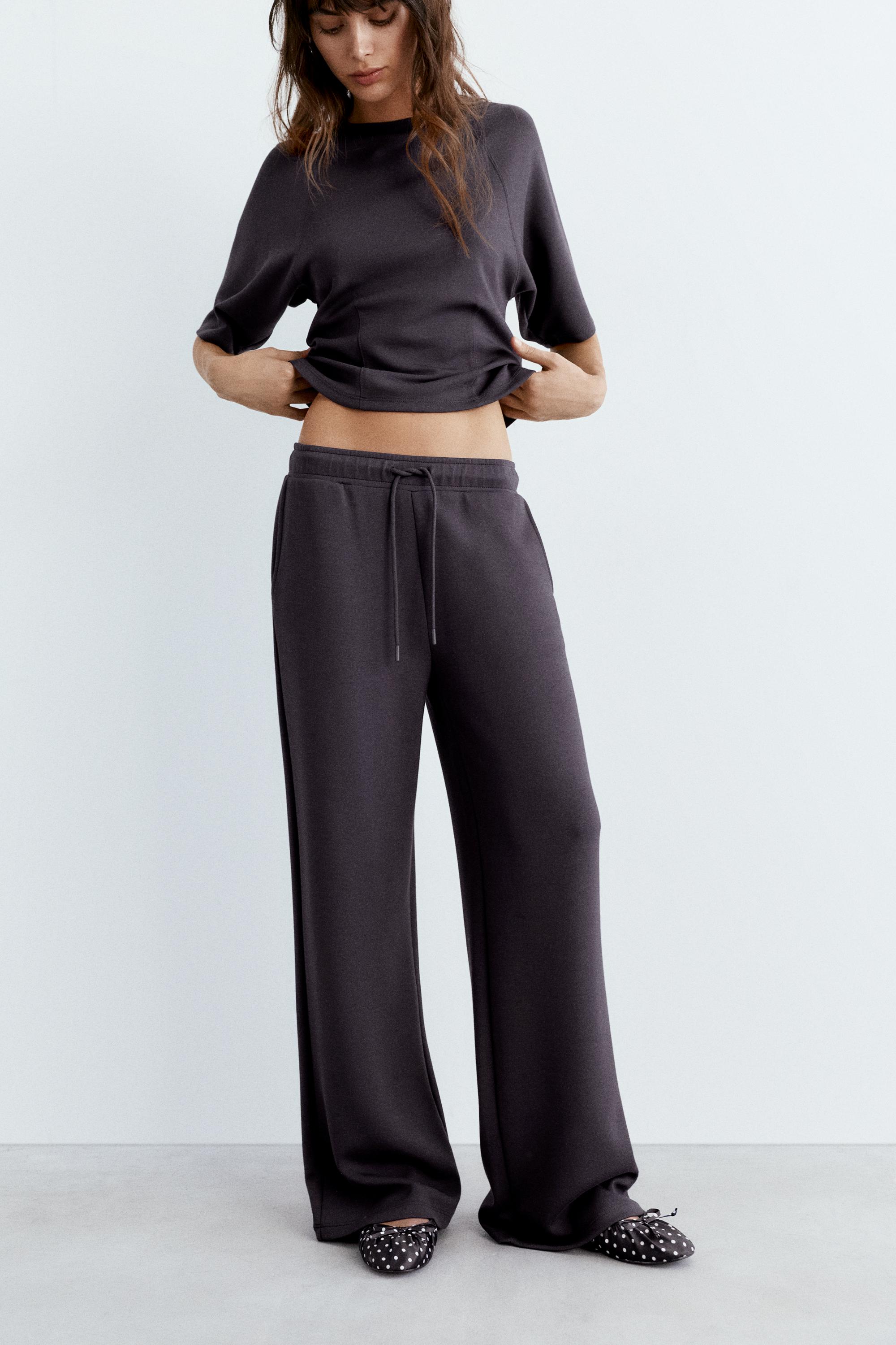 Soft-touch wide-leg trousers — Black