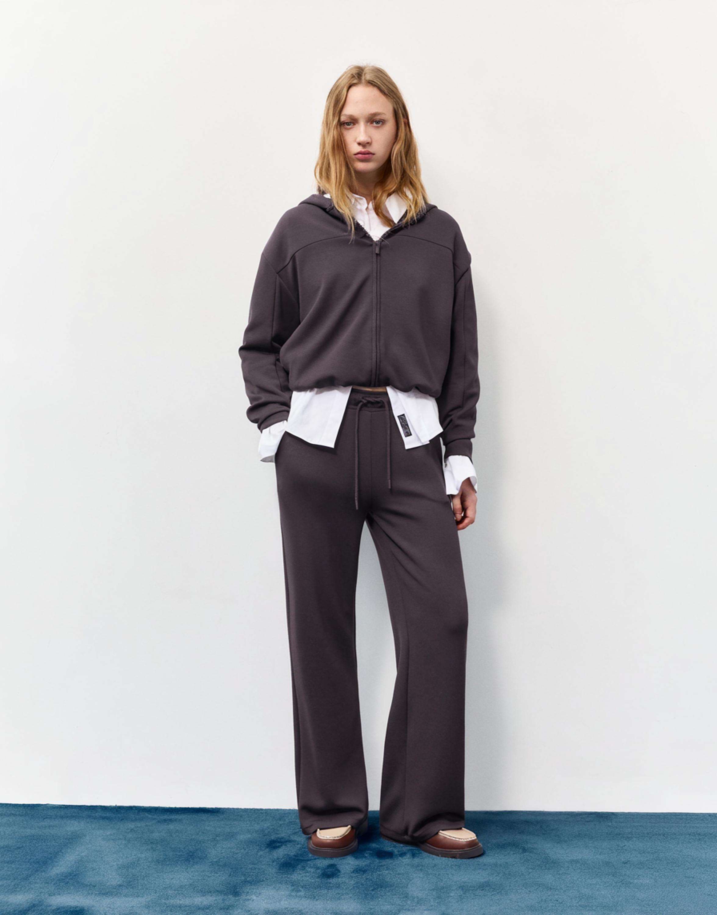 Soft-touch wide-leg trousers — Black