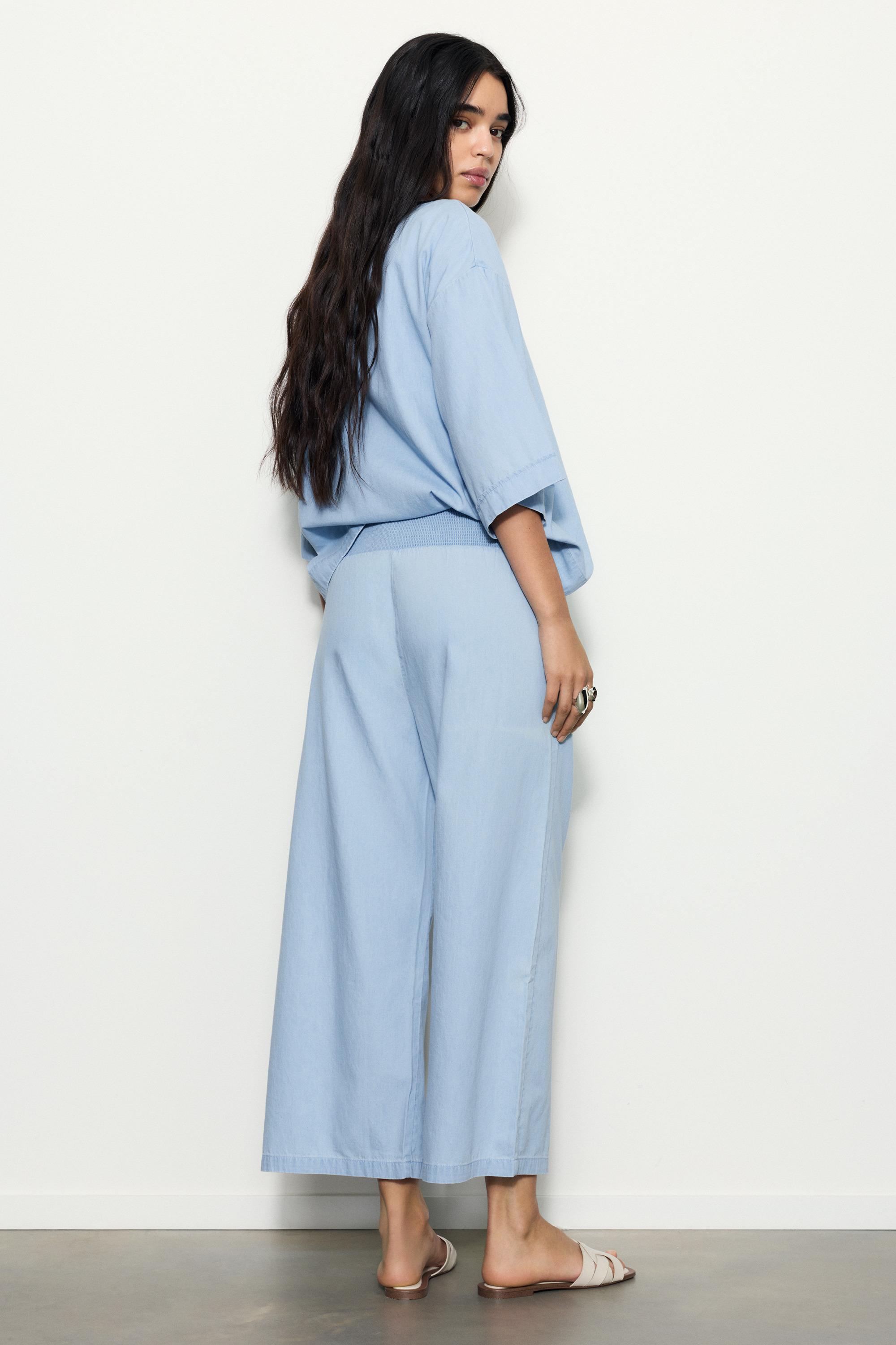 Flowing denim trousers with elasticated waist — Pale blue