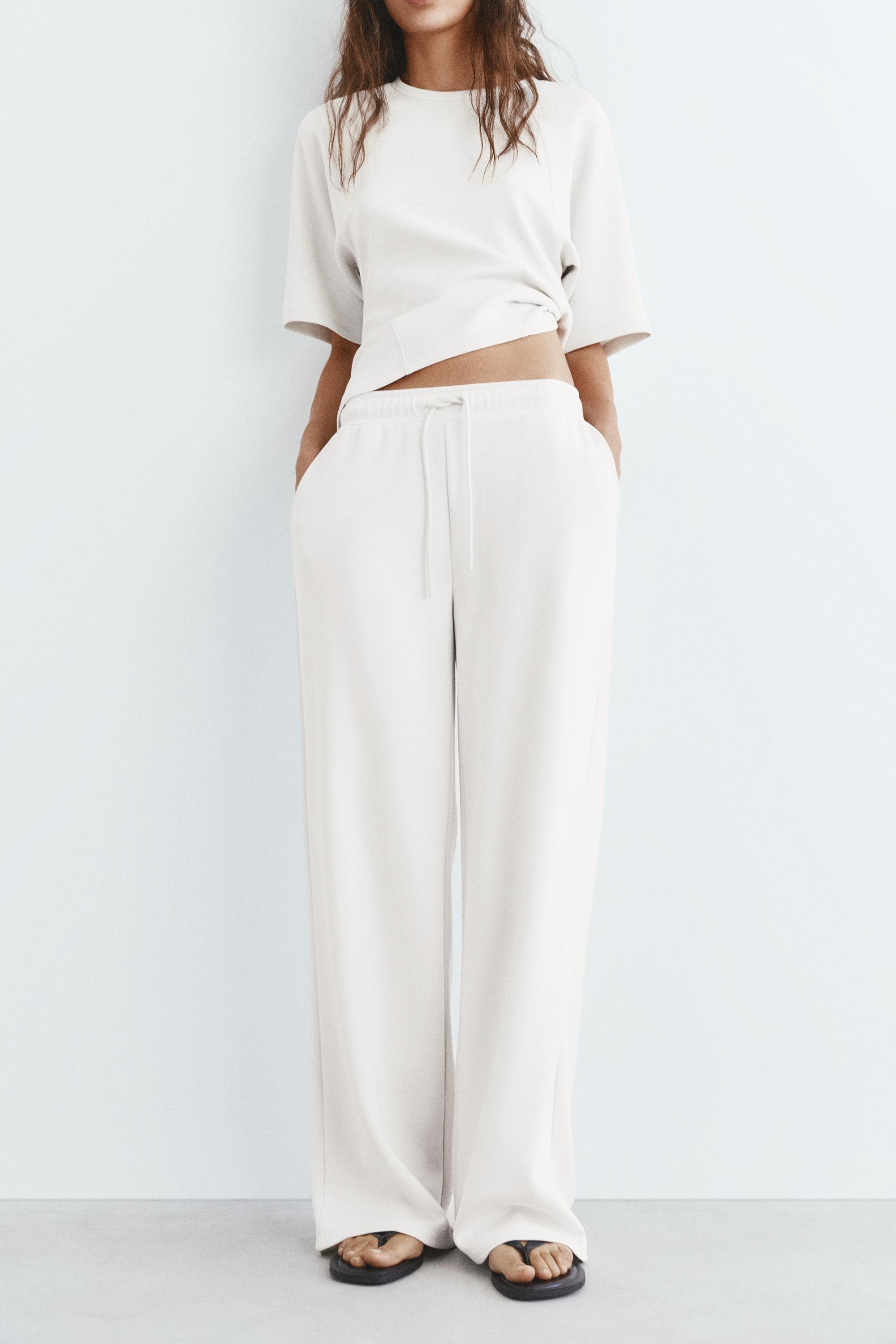 Soft-touch wide-leg trousers — Ecru