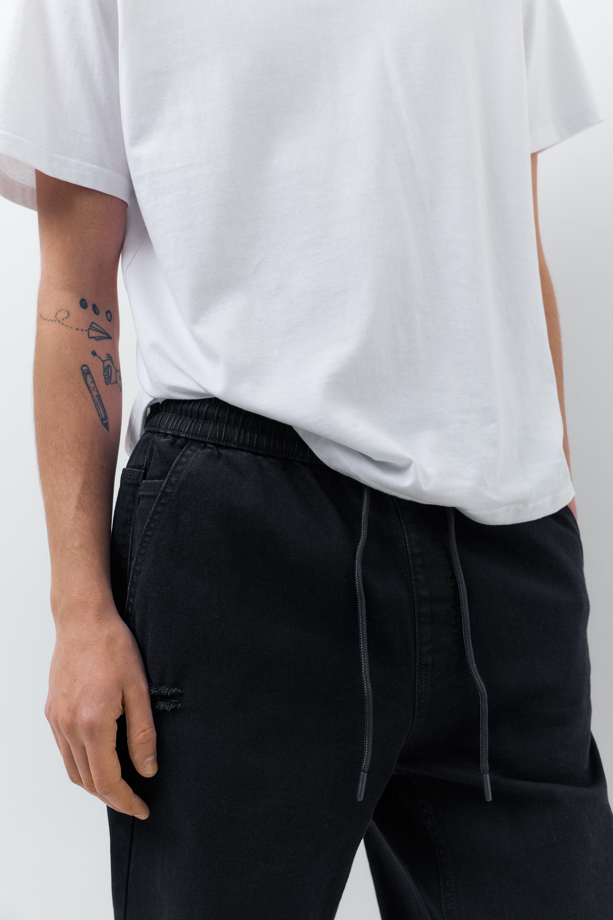 Ripped denim jogger trousers — Black