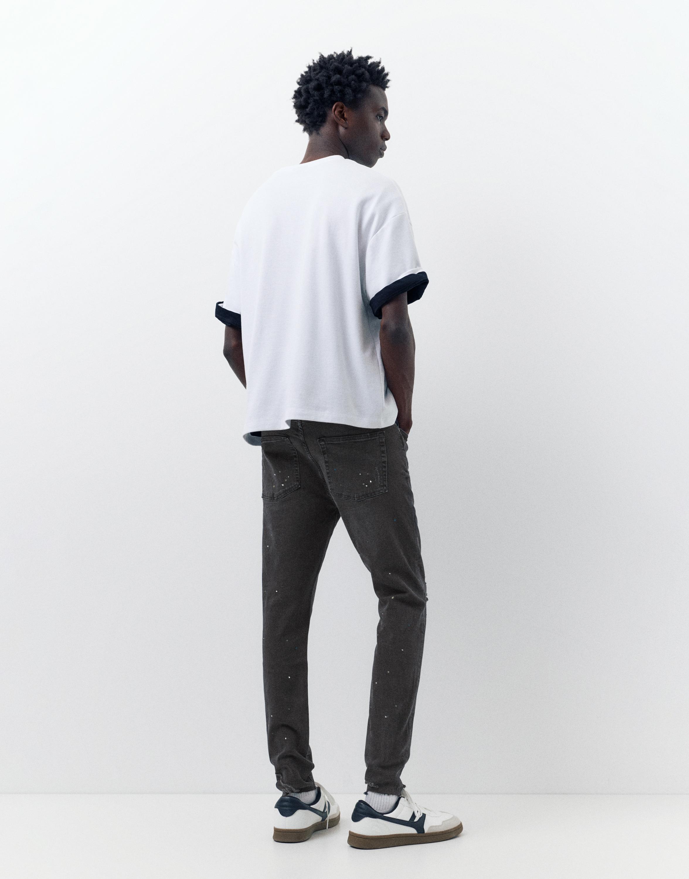 Paint splatter carrot-fit jeans — Faded black