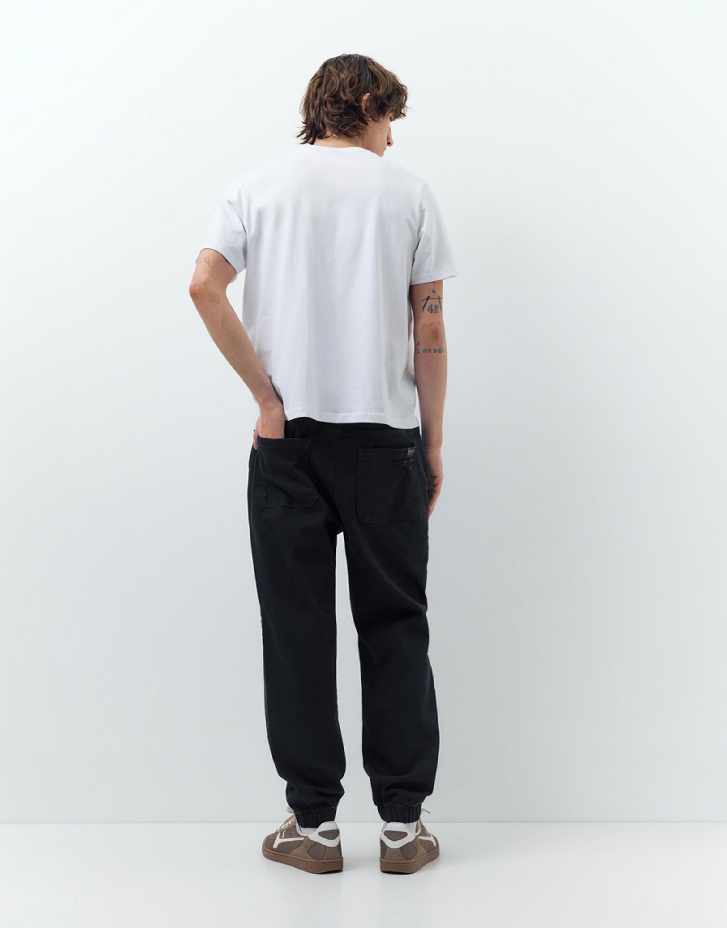 Ripped denim jogger trousers — Black