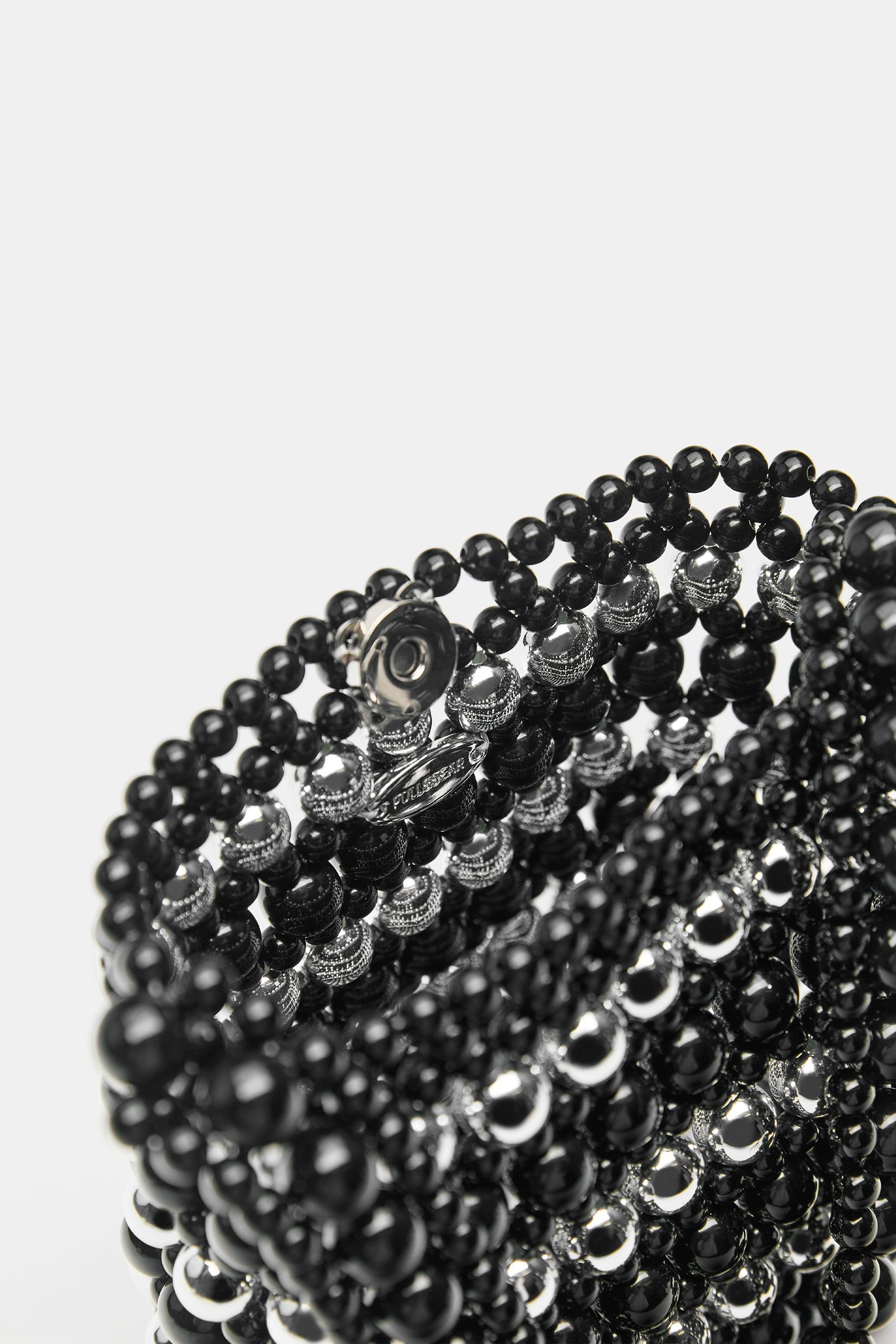 Striped beaded handbag — Black