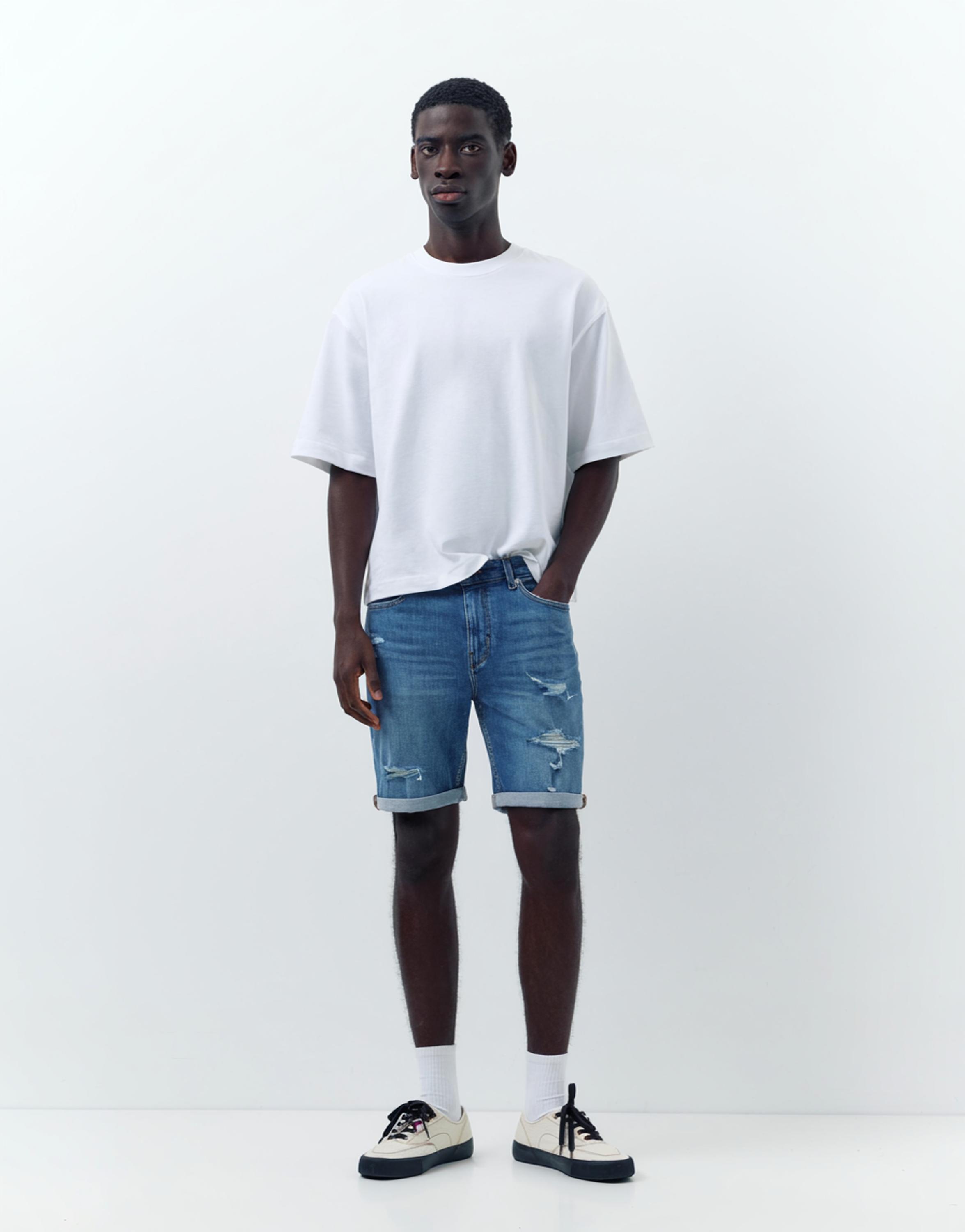 Ripped denim Bermuda shorts — Medium blue
