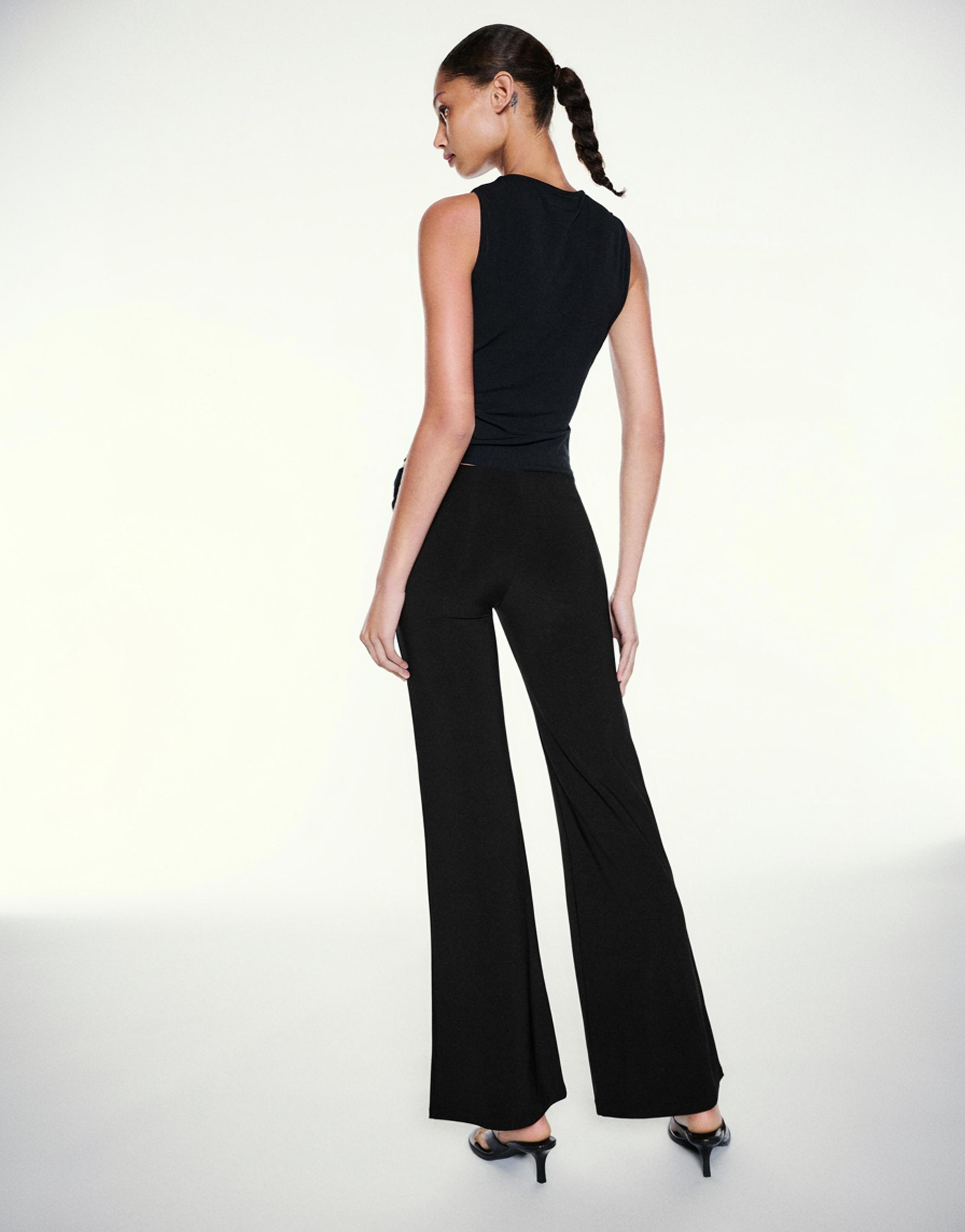 Black flared trousers — Black