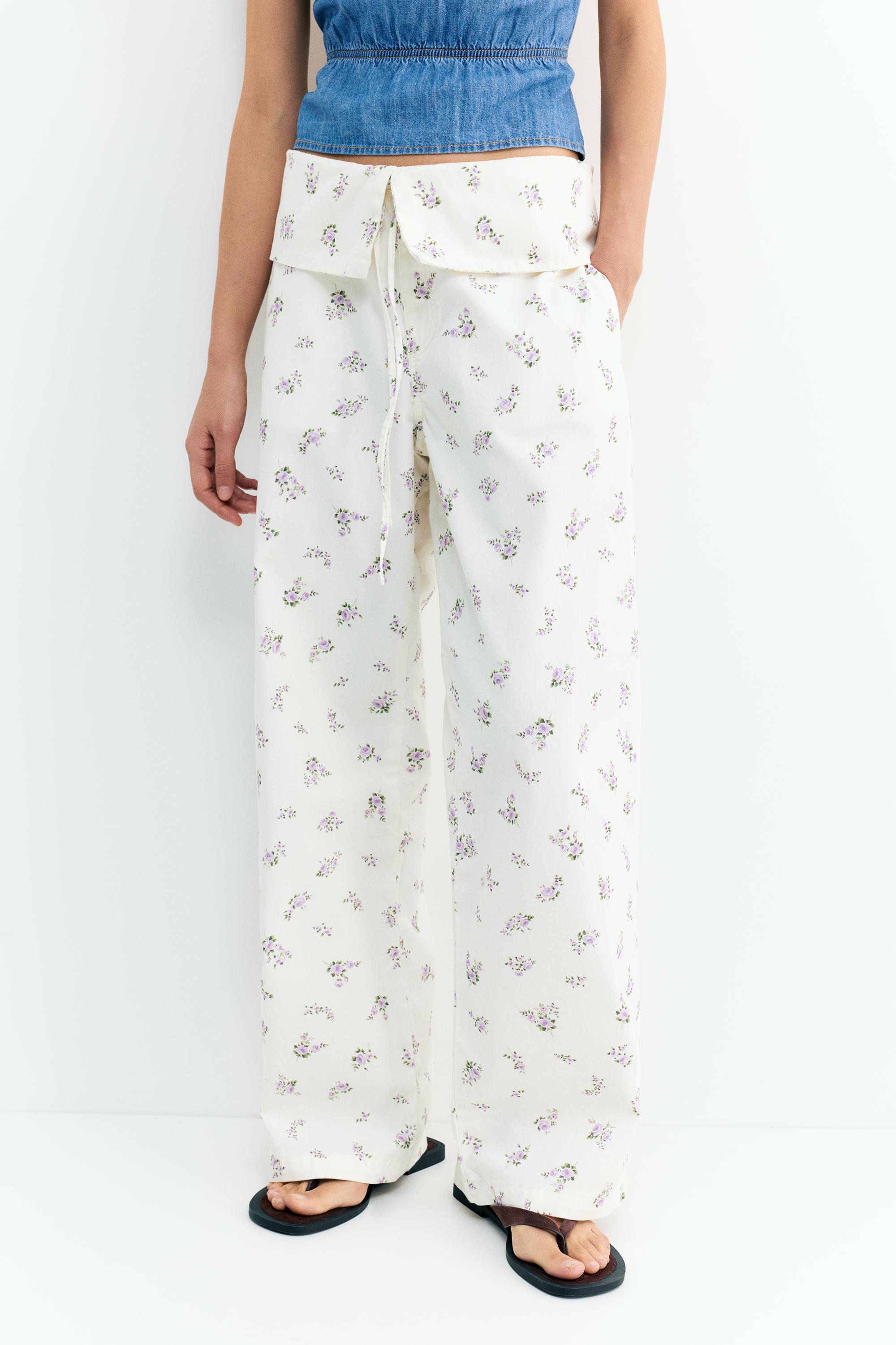 Floral trousers with turn-up waist — White