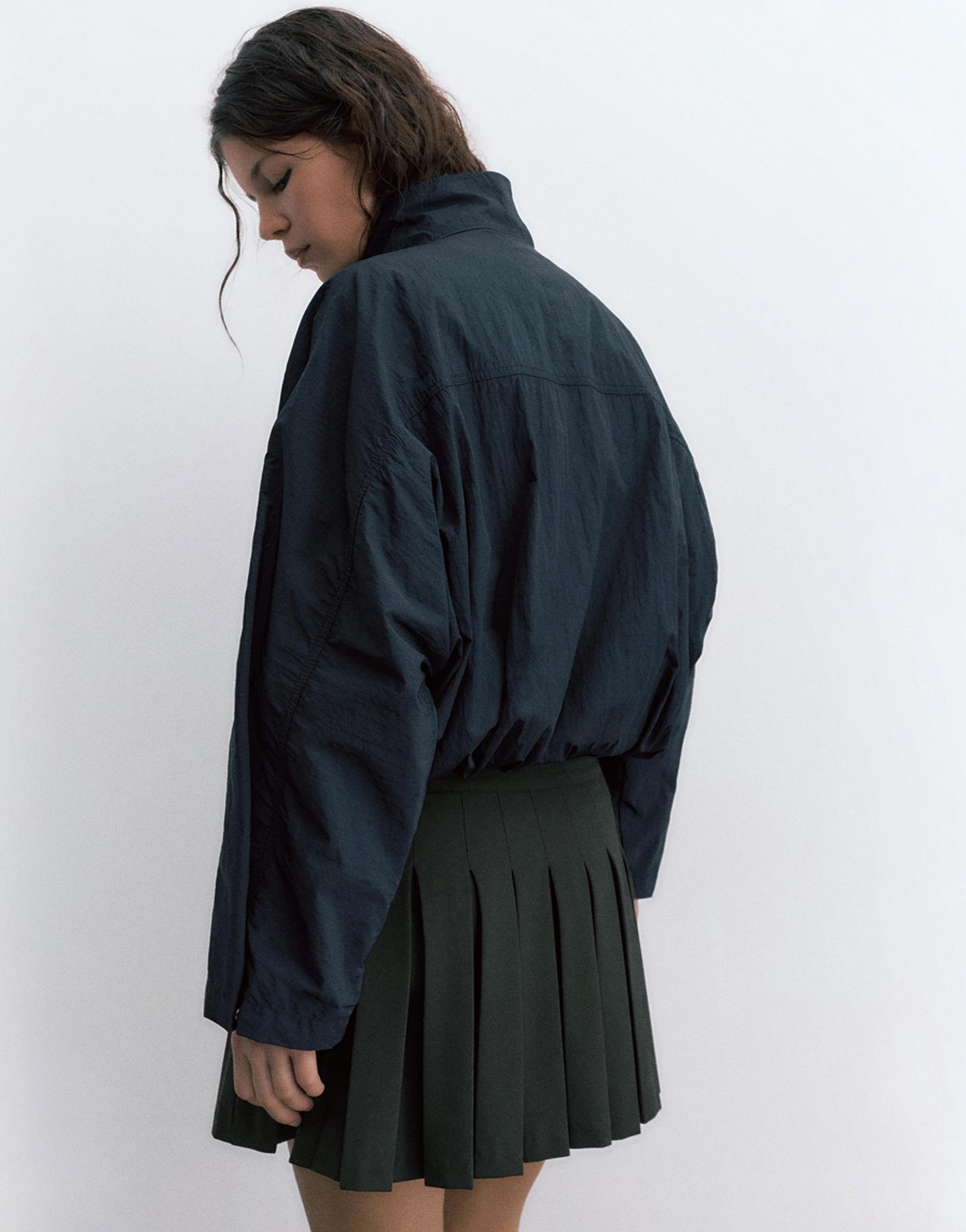 Pleated mini skirt — Black