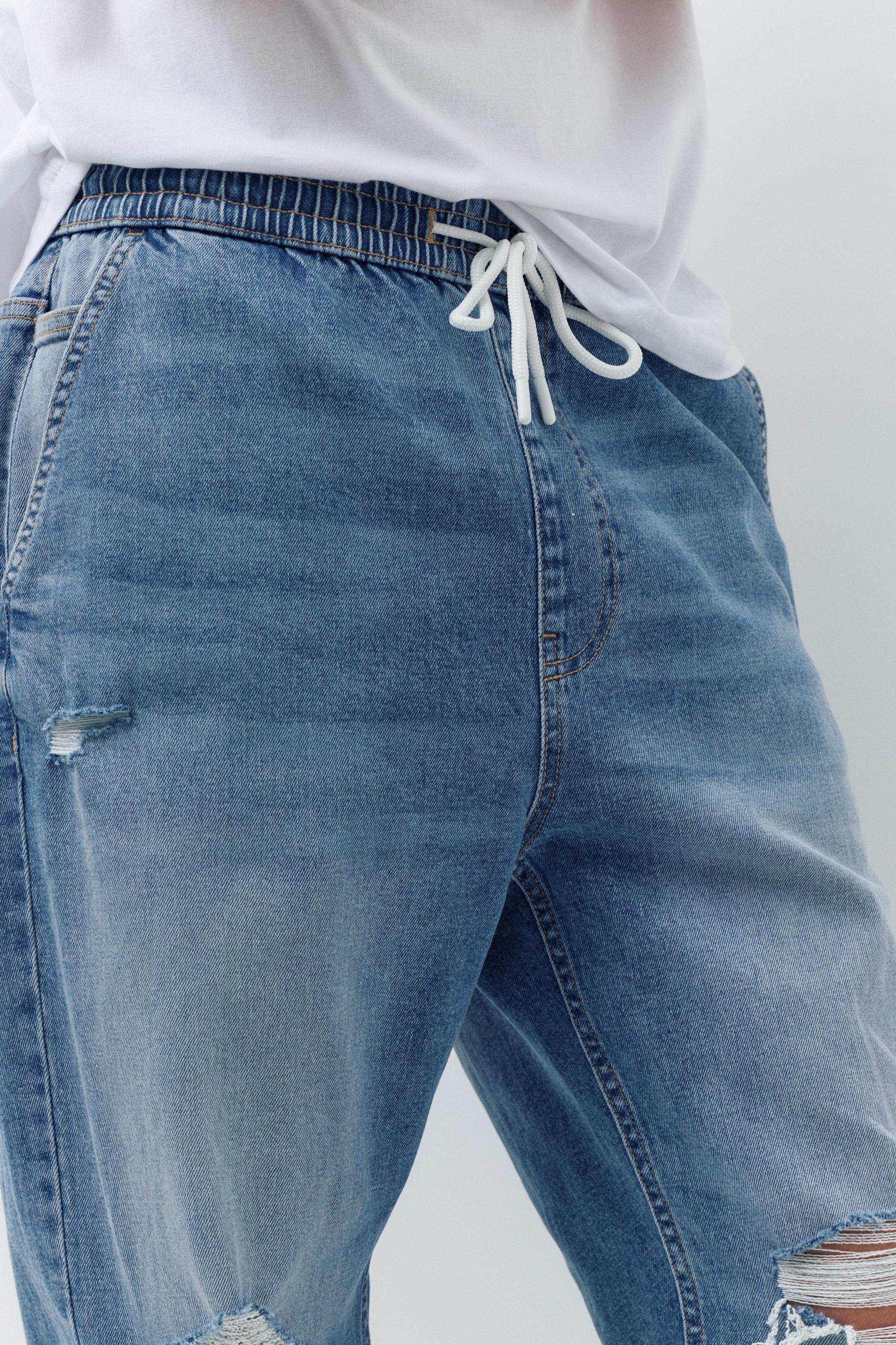 Ripped denim jogger trousers — Pale indigo
