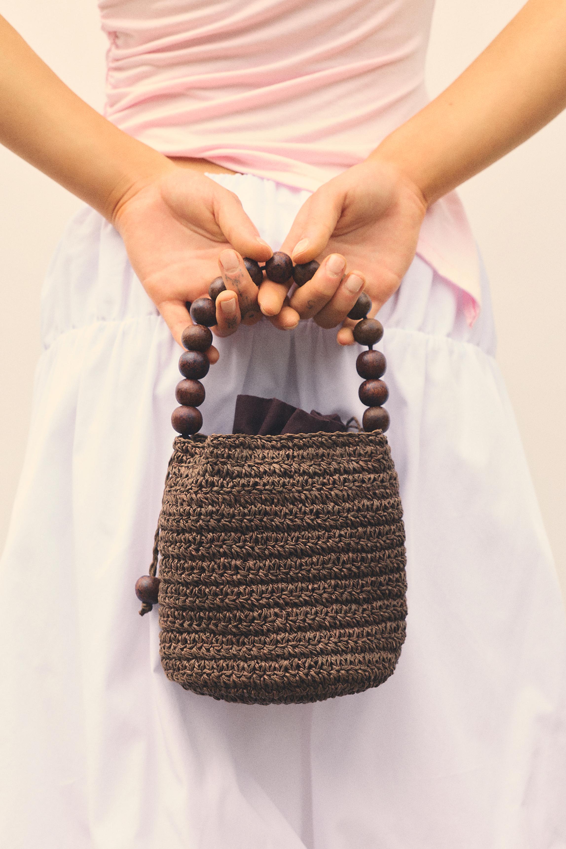 Beaded bucket handbag — Brown