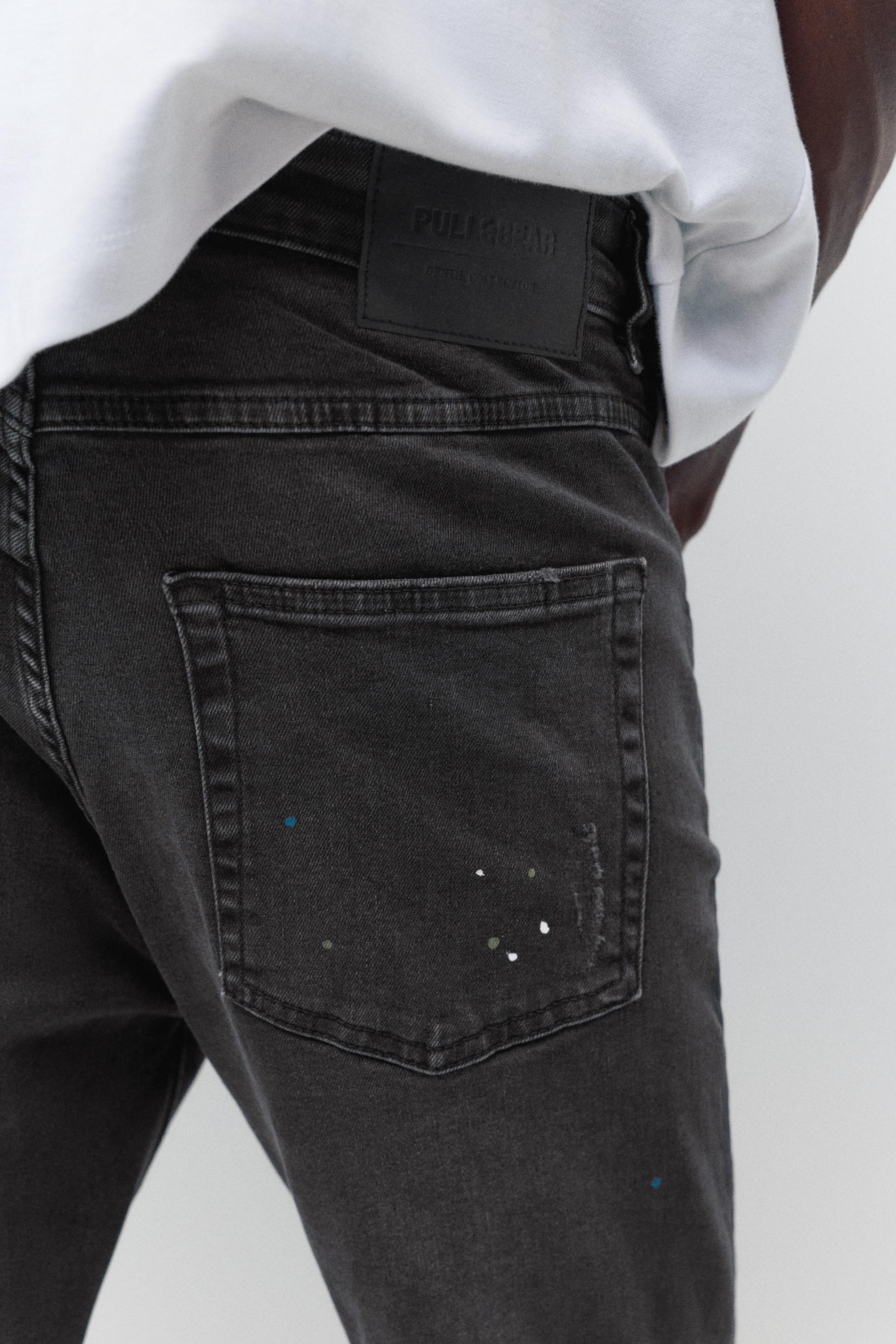 Paint splatter carrot-fit jeans — Faded black