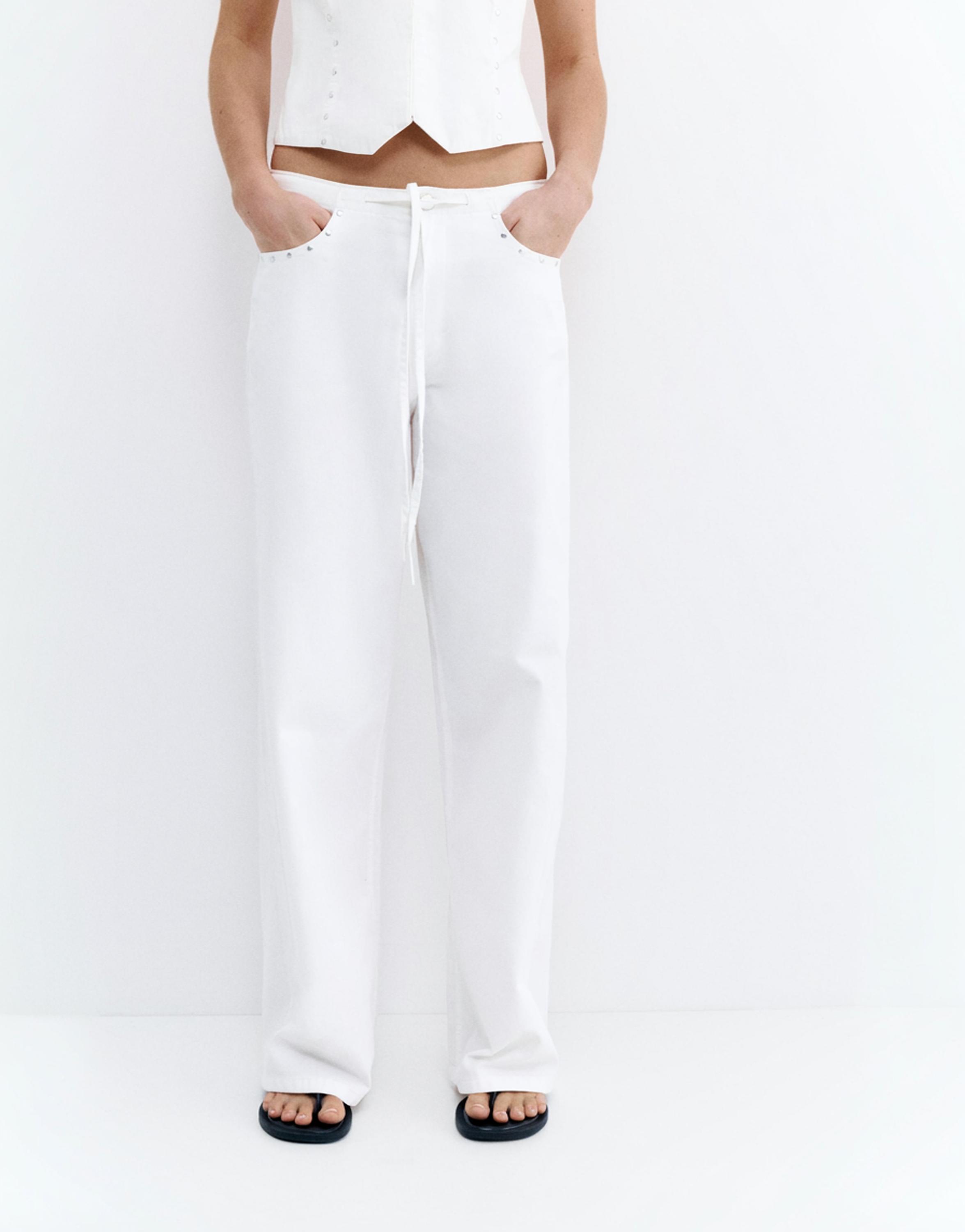 White studded baggy jeans — White
