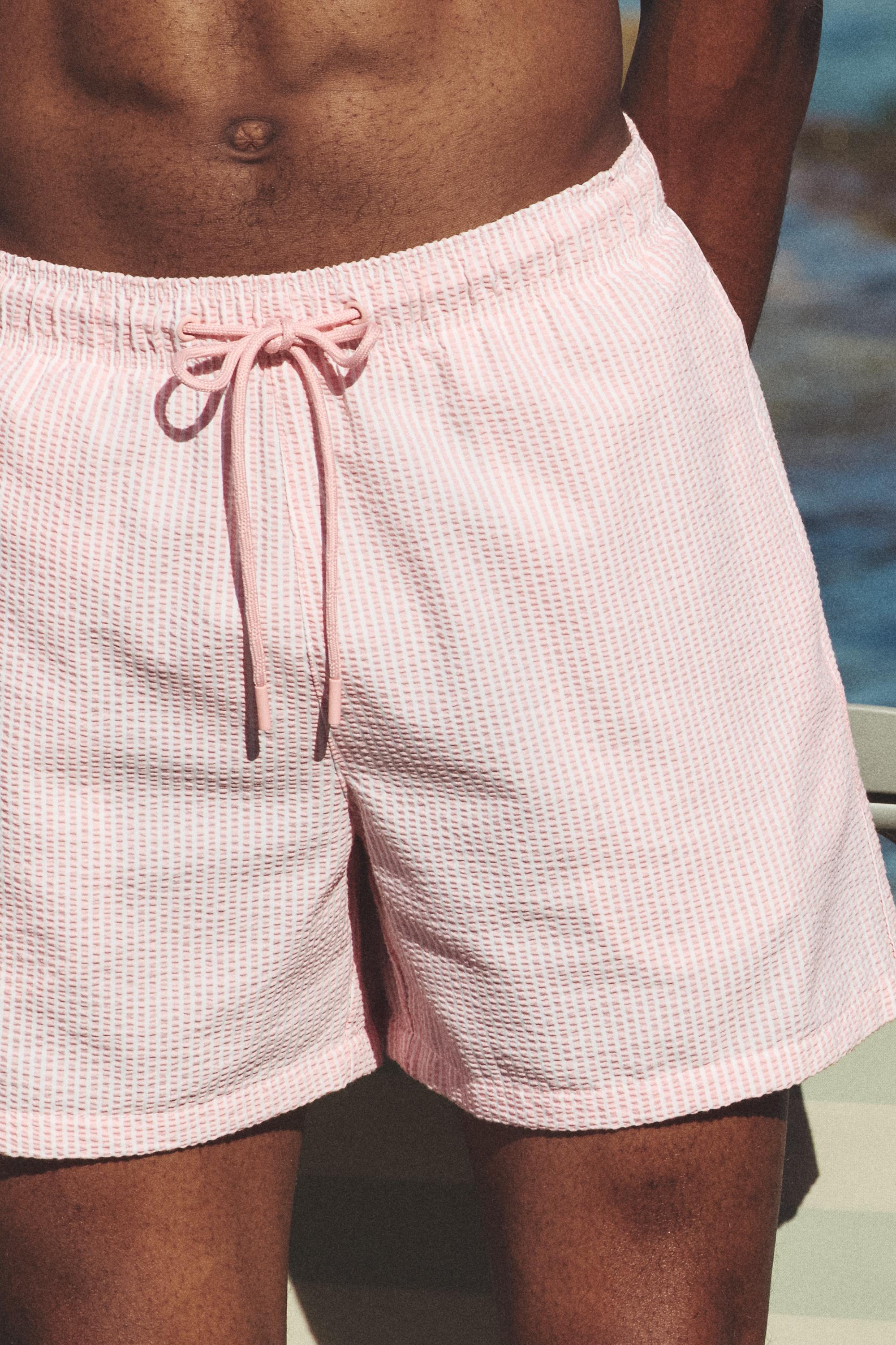 Striped seersucker swimming trunks — Pink