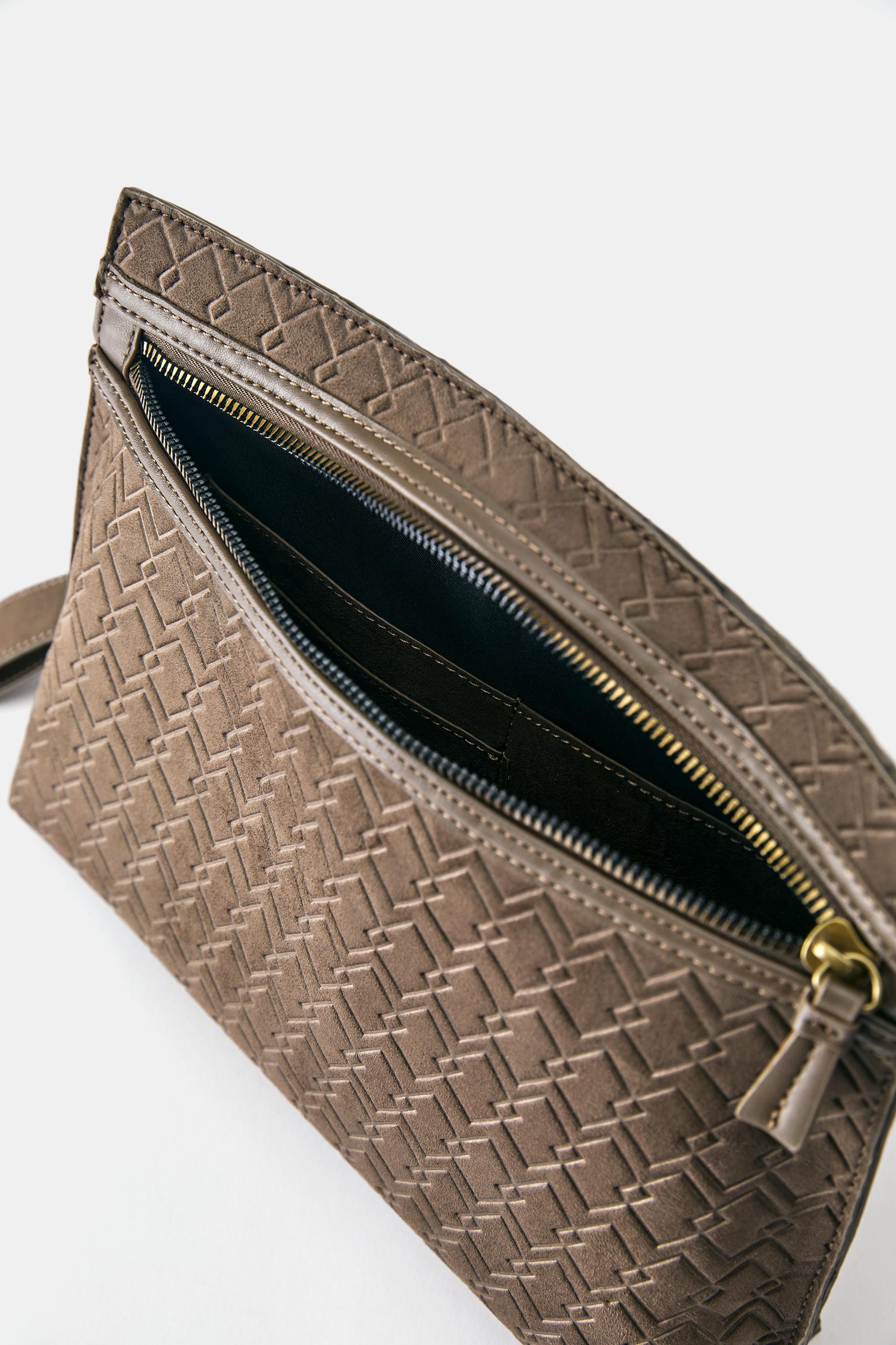 Embossed handle clutch bag — Brown