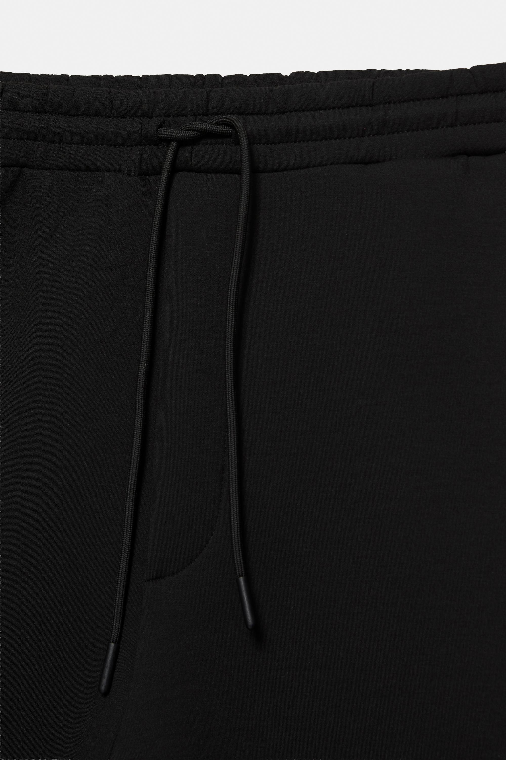 Neoprene-effect baggy trousers — Black