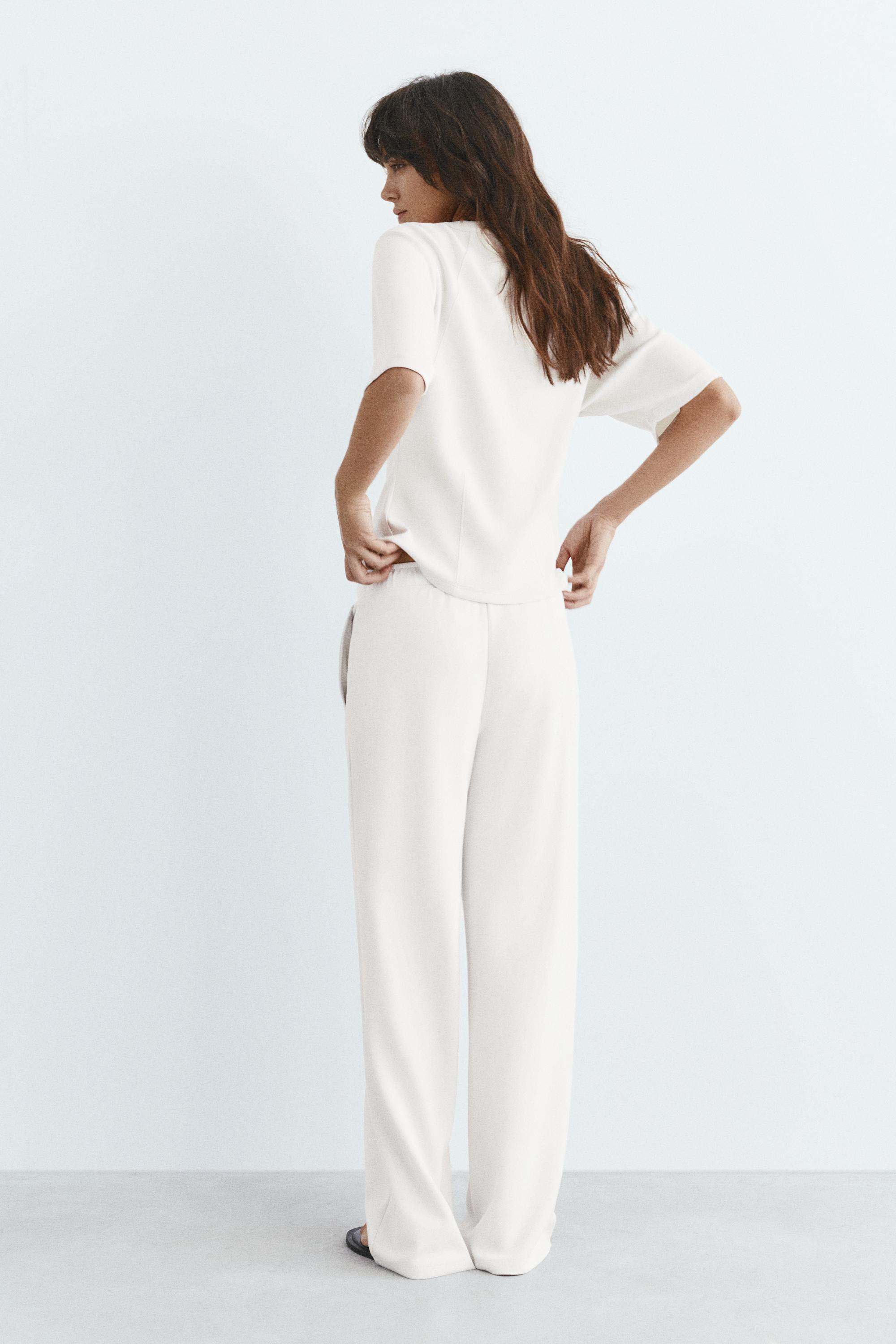 Soft-touch wide-leg trousers — Ecru