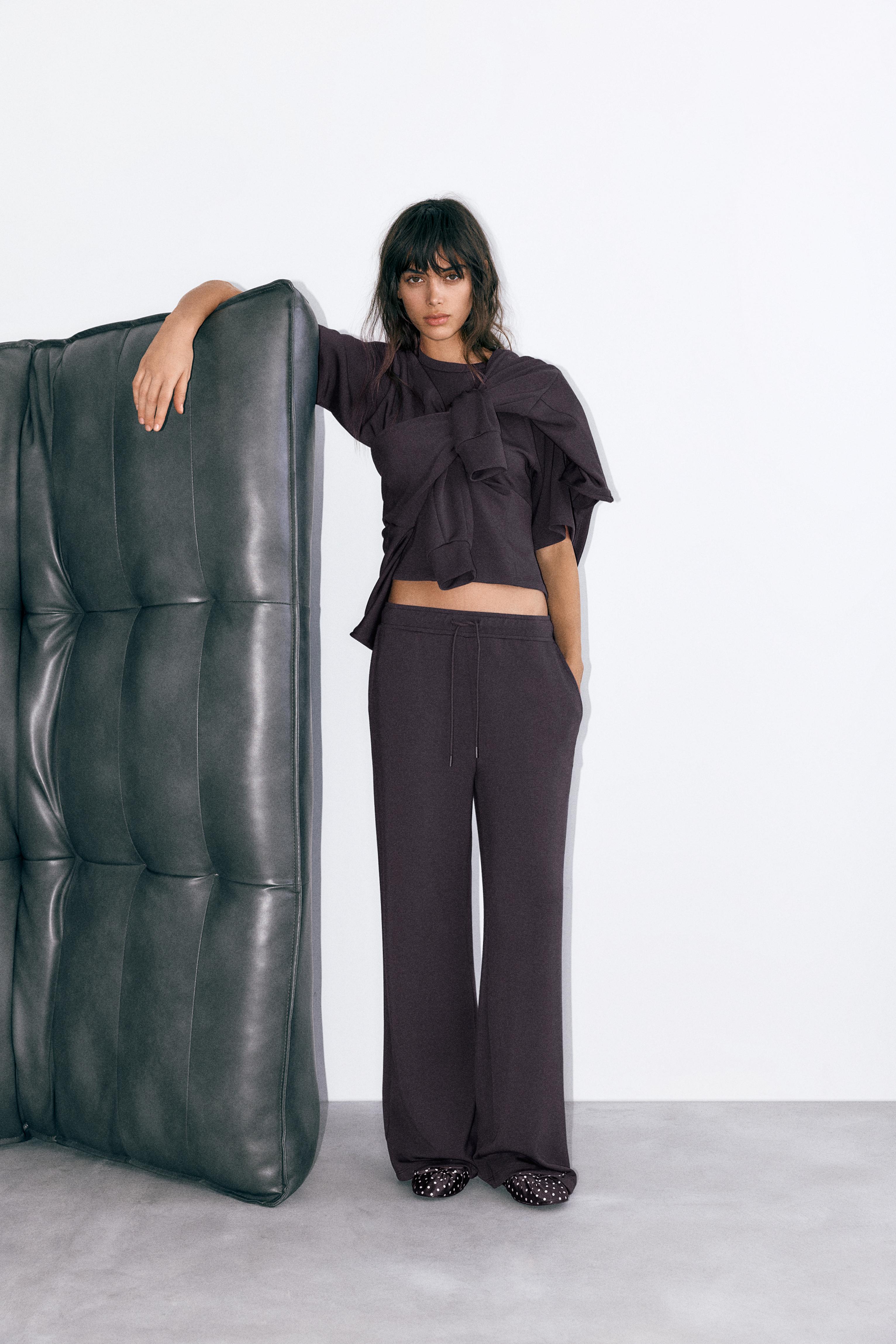 Soft-touch wide-leg trousers — Black