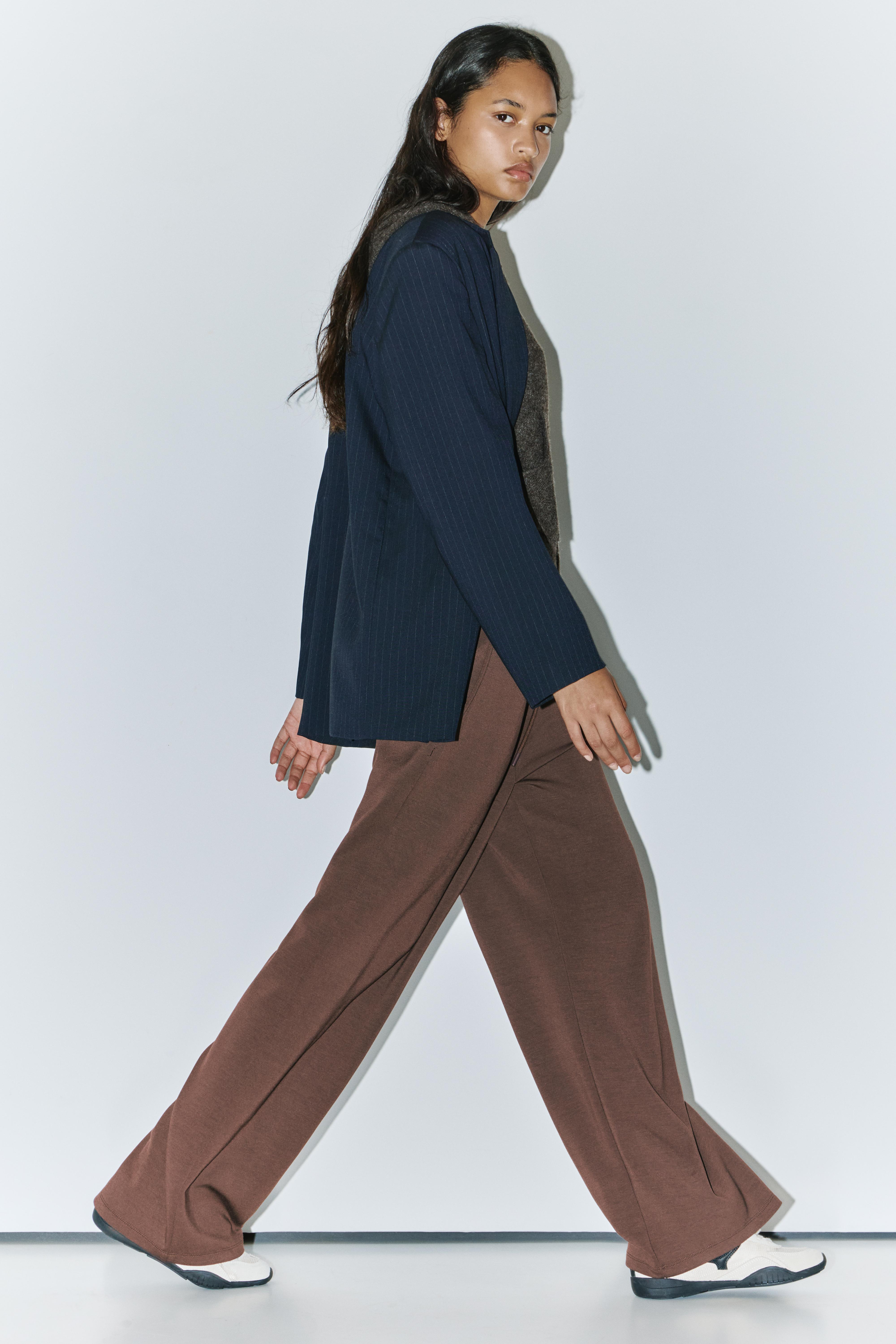 Soft-touch wide-leg trousers — Brown