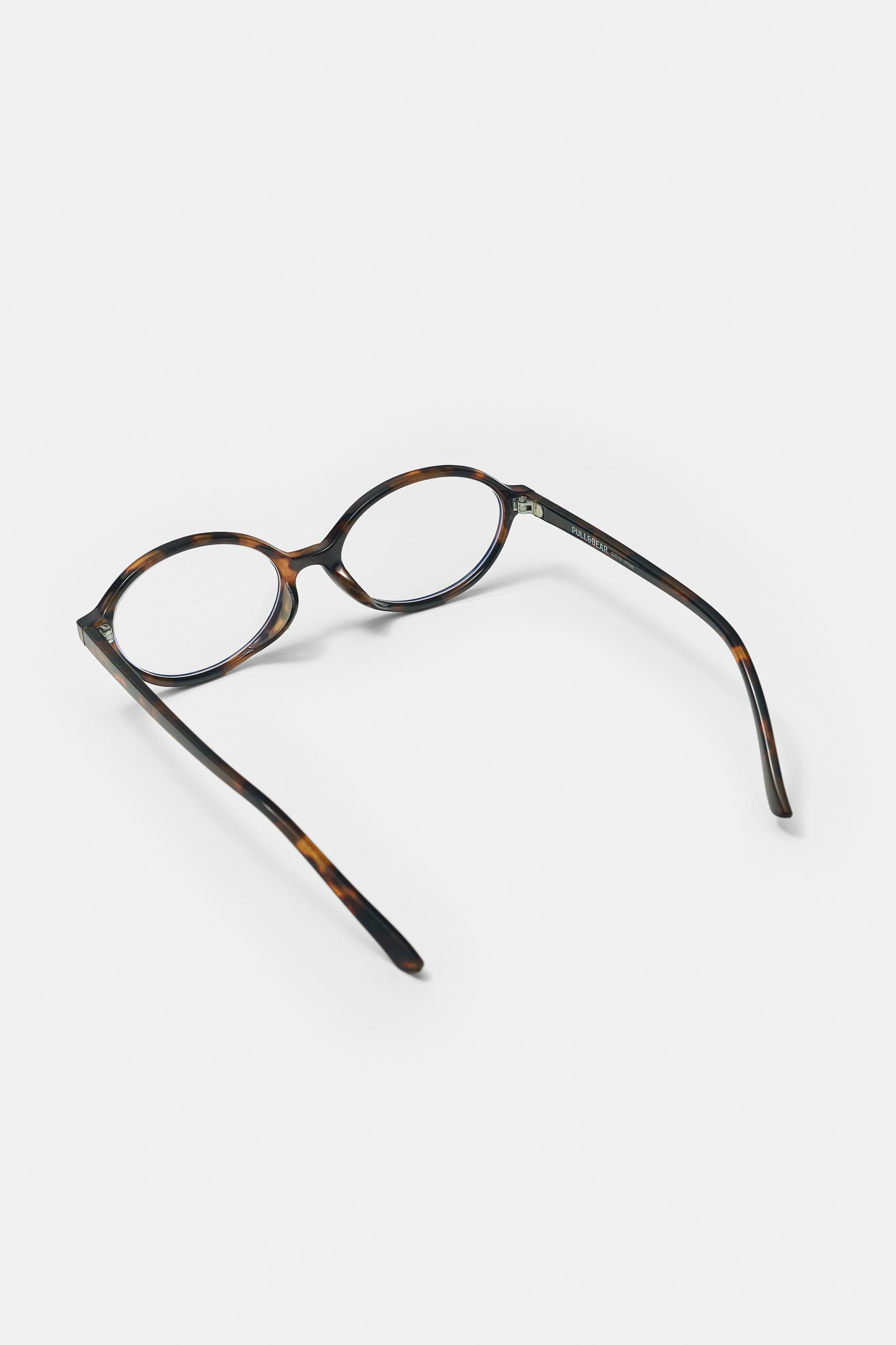 Oval tortoiseshell-effect sunglasses — Brown
