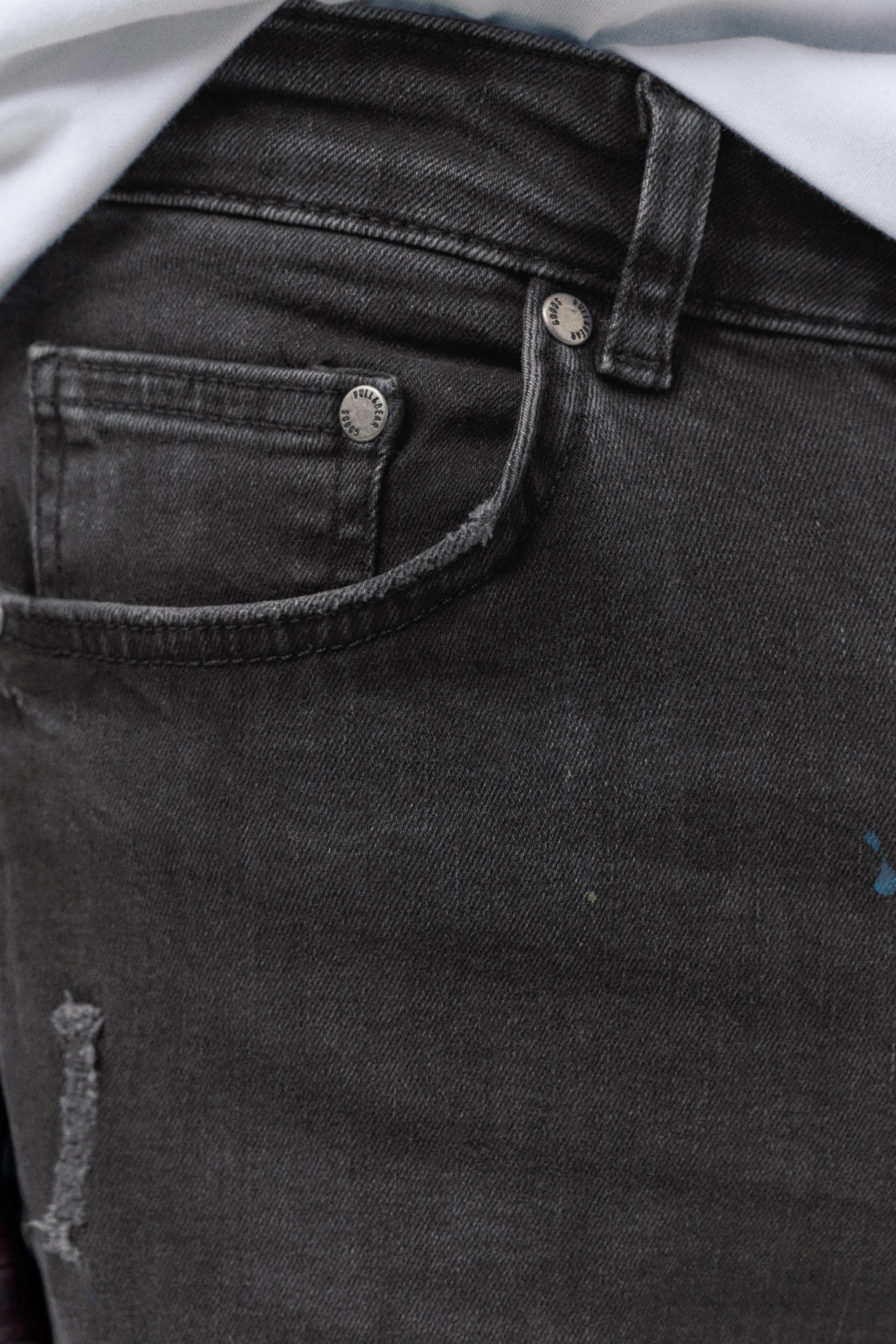 Paint splatter carrot-fit jeans — Faded black