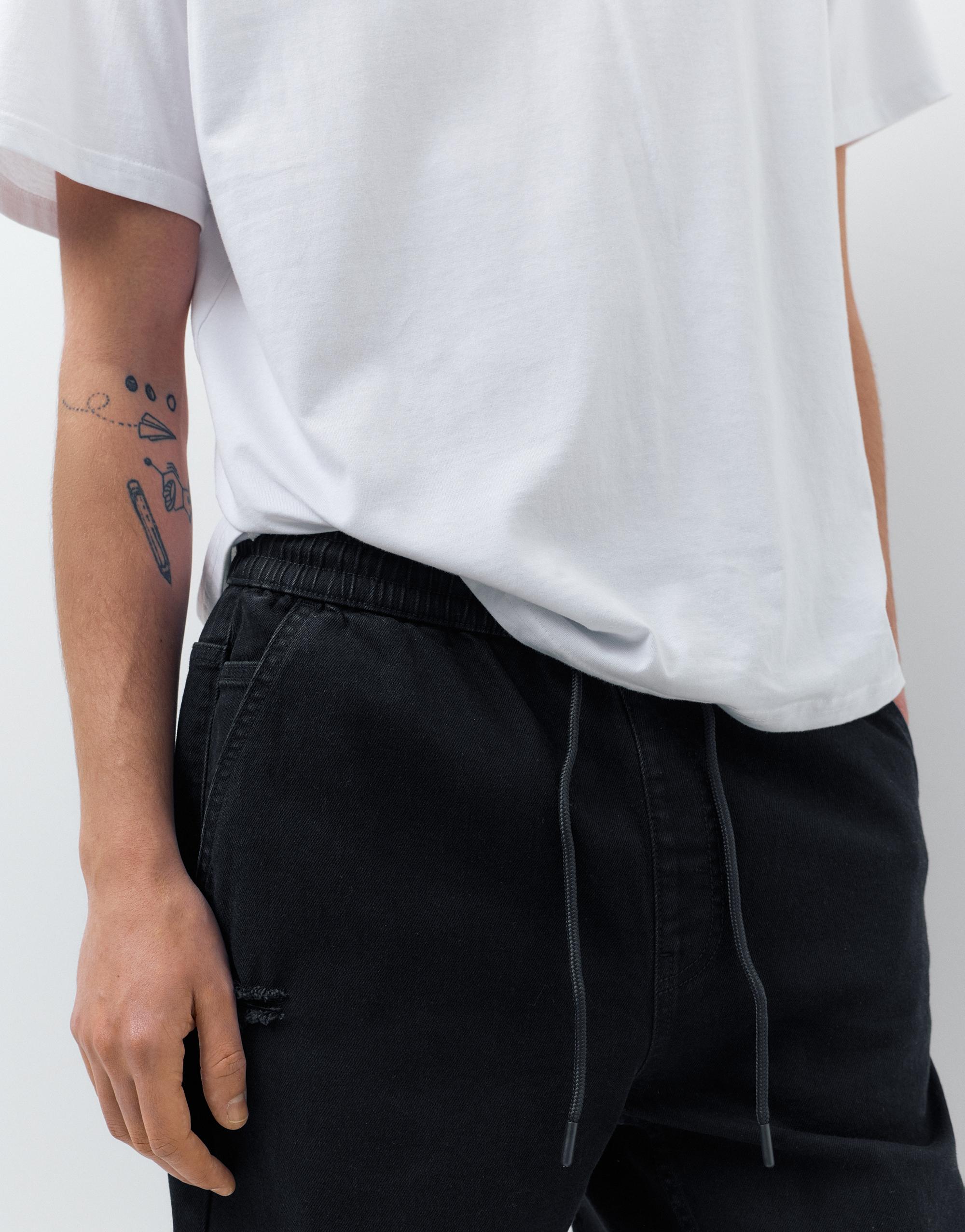 Ripped denim jogger trousers — Black