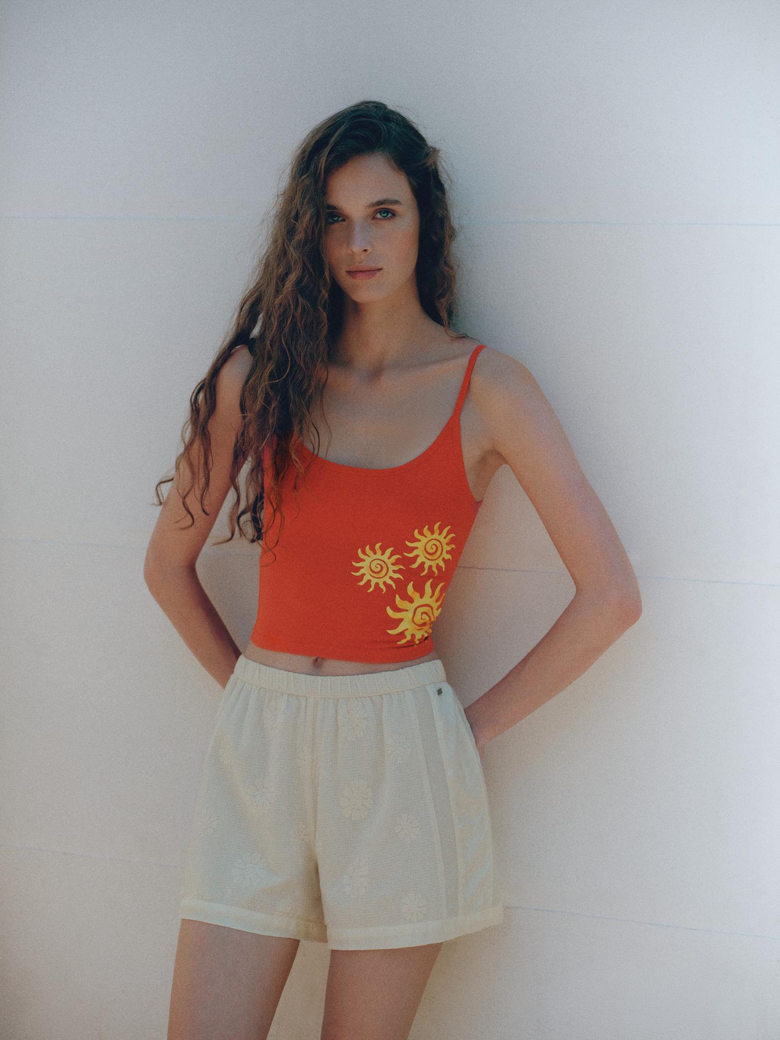 Orange sun graphic top — Red