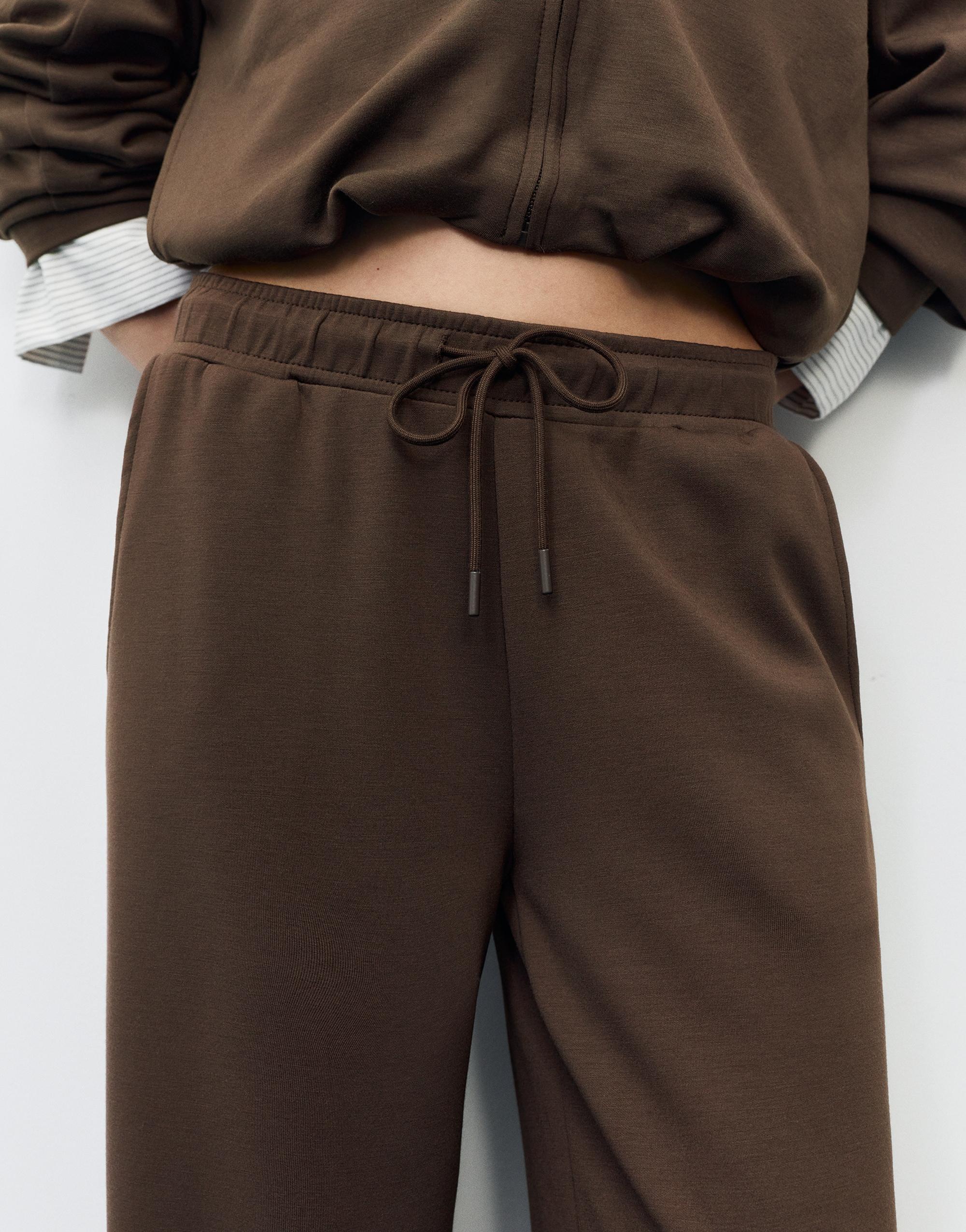 Soft-touch wide-leg trousers — Brown