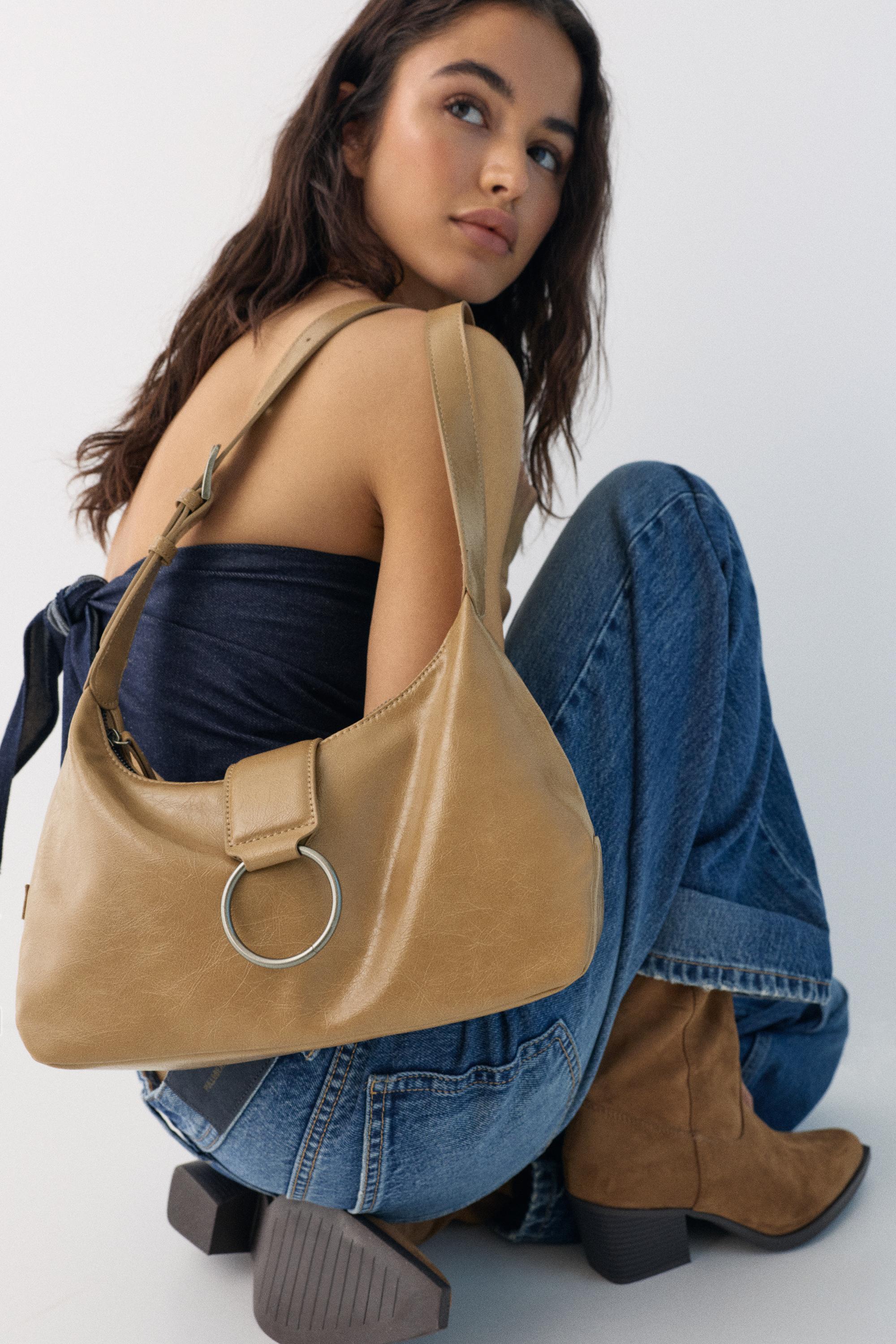 Crossbody bag with buckle — Leather